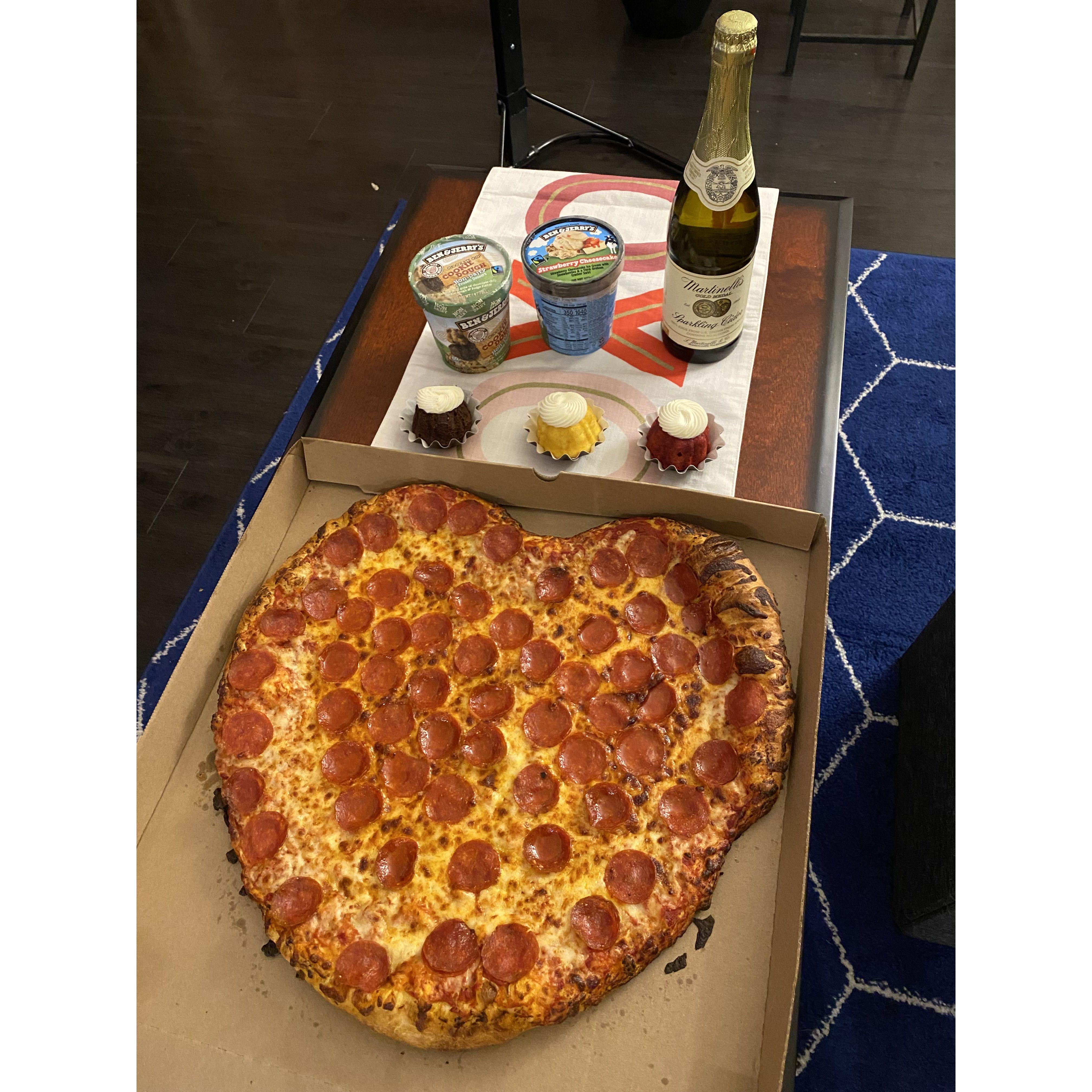 Our first Valentine's day and  Costco made us a heart shaped pizza :')
