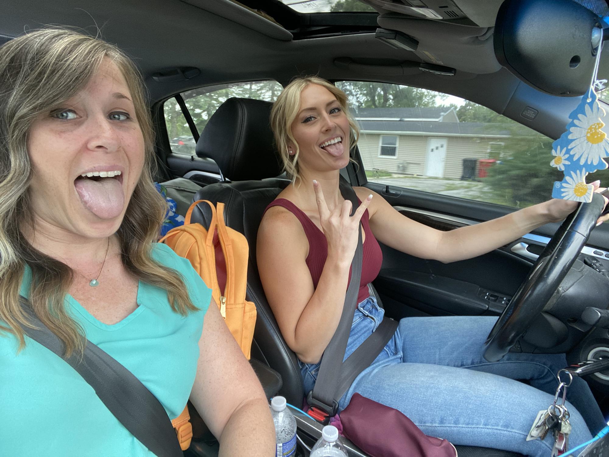 Caeli and Britt, jammin in the car on the way to Brittany's wedding shower in 2021