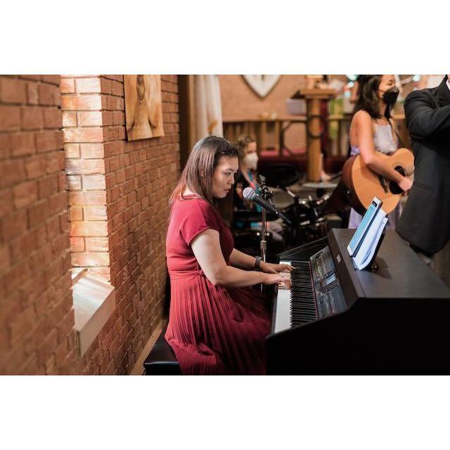 Worship leader, aka Jin Sheen's good friend Charis