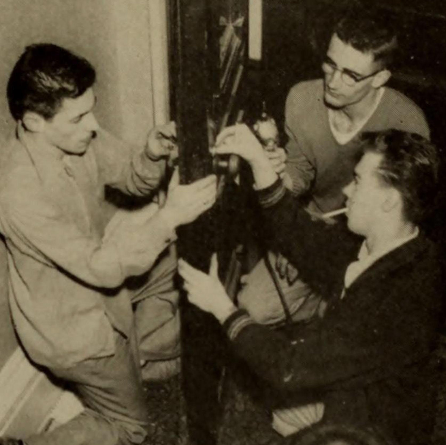 Fraternity brothers working on 547 Foyer door