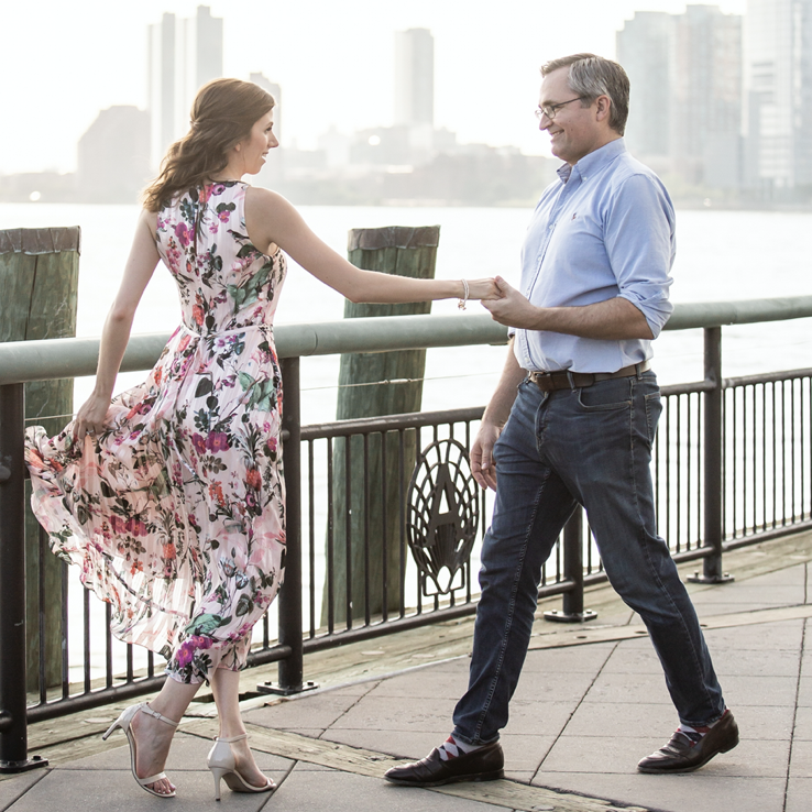 Dancing at our engagement spot on Pier A (2021).