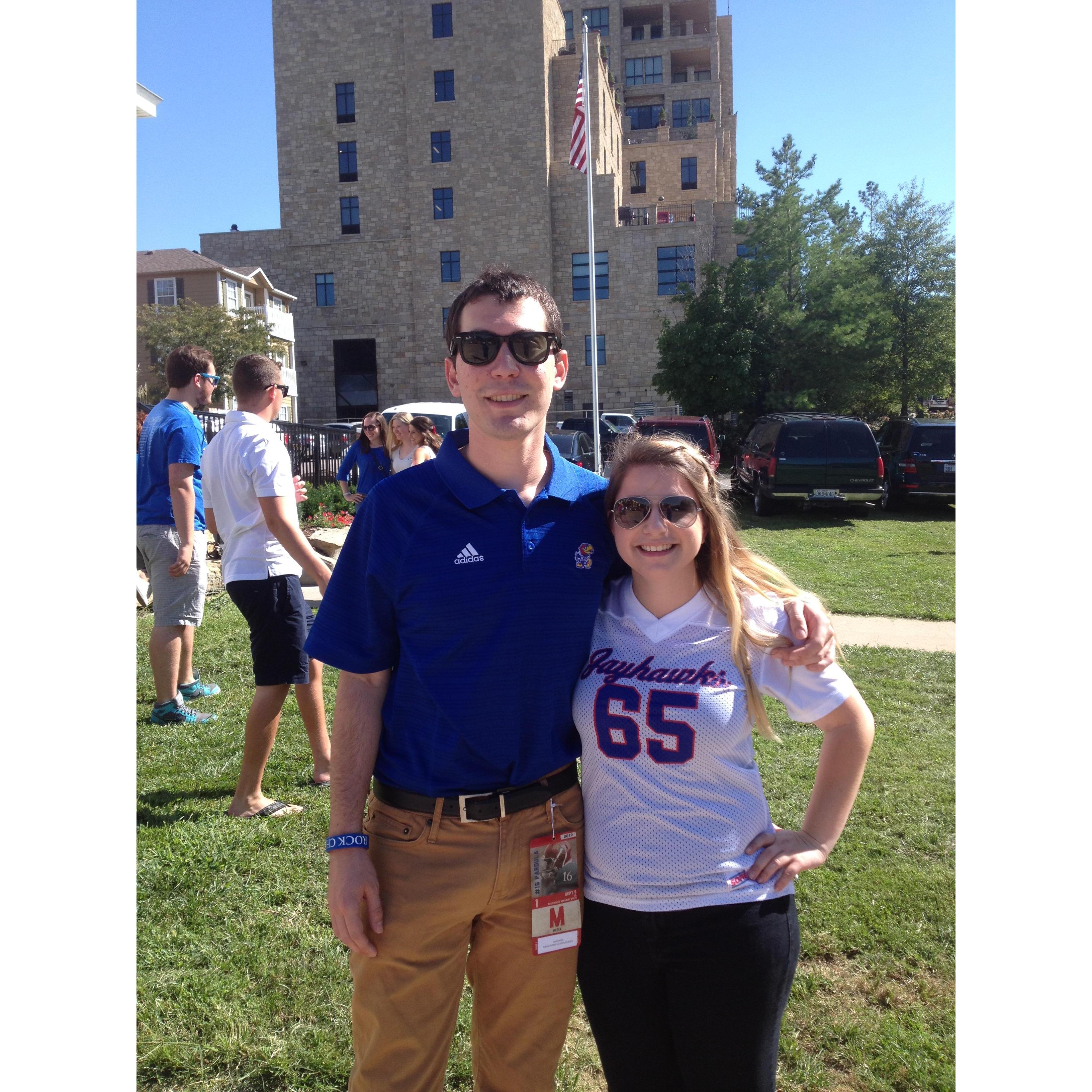 The first day of Austin's new position as a communications assistant at KU athletics. **look at that press pass** Fall 2014.
