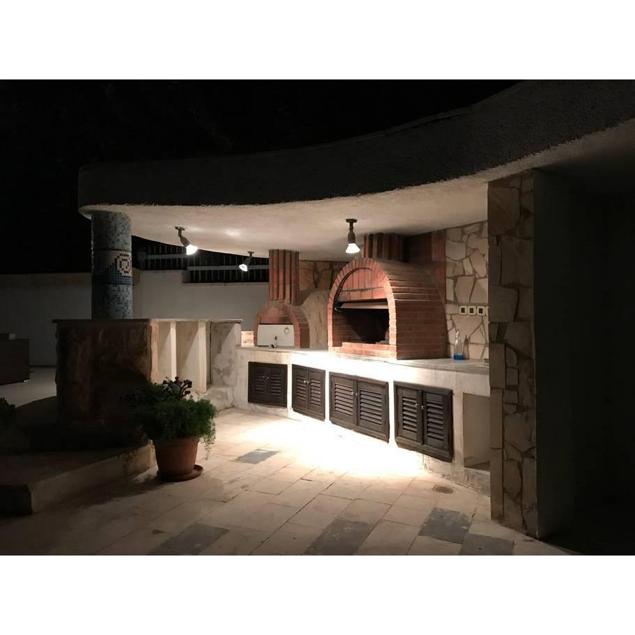 Come any time after you arrive and check in to your Airbnb or hotel, and at night we'll have Chef Omar Shriem cook amazing beef, lamb, chicken, and veggie kabobs at the poolside brick oven.