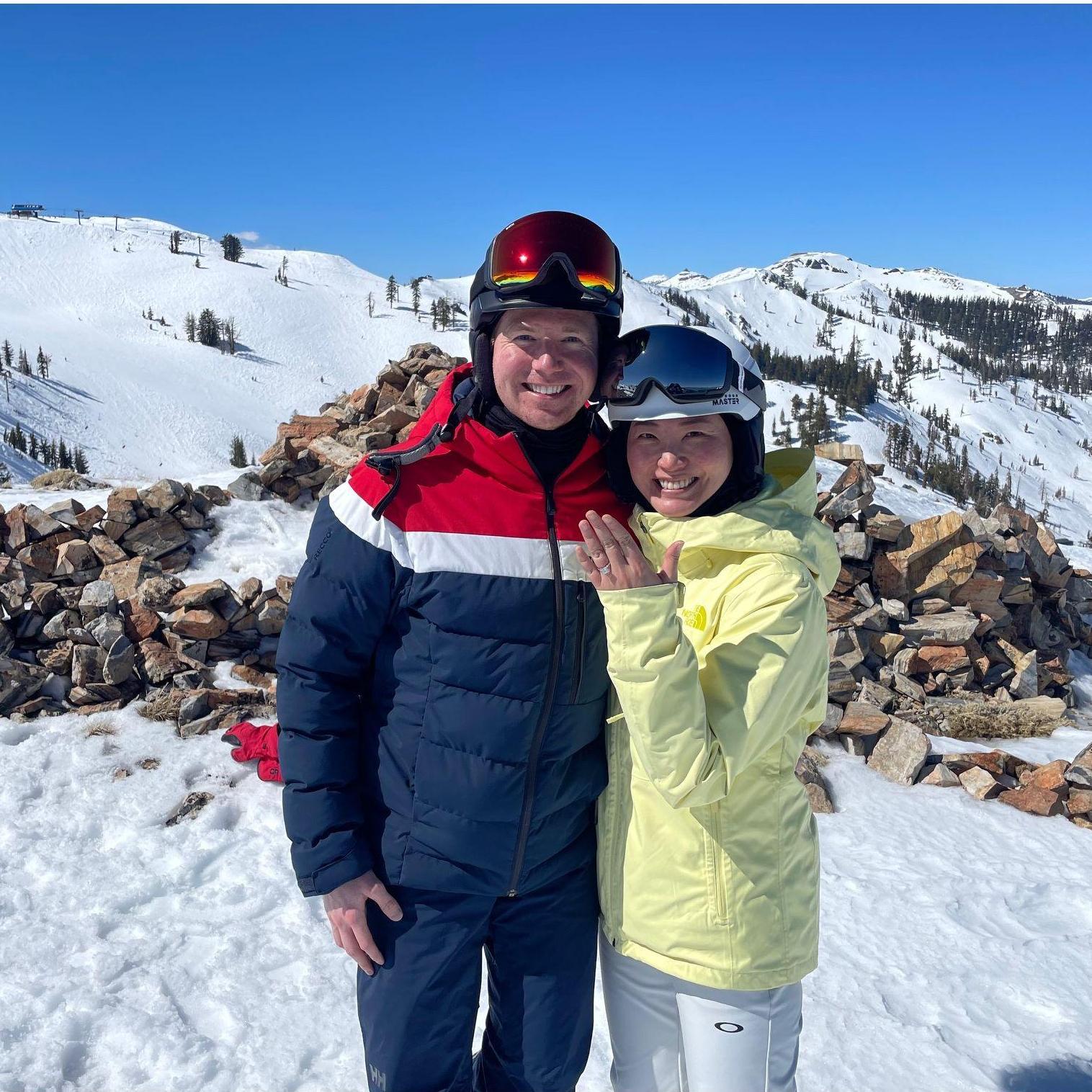 On March 16, 2024, at the summit of Palisades Tahoe, with the lake shimmering below, Dan got down on one knee—turning a perfect ski day into the start of forever.
