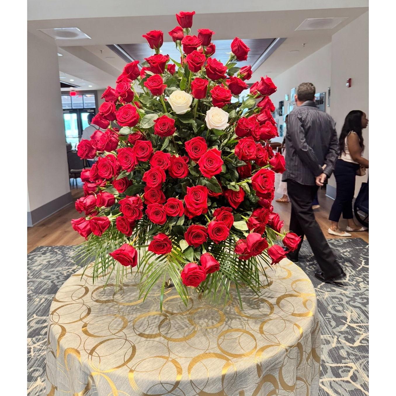 Franklin gave Alex two roses on the night of their first date. This is the arrangement Franklin's mother, Melissa, had for us upon entering our incredible engagement party.
