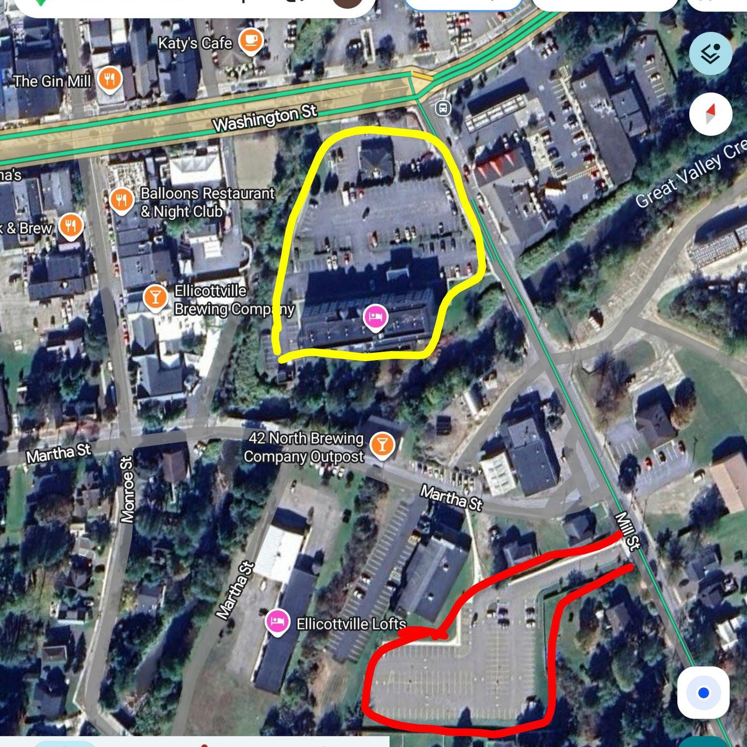 Red is the public parking lot. Yellow is the hotel and shuttle pick-up spot!
