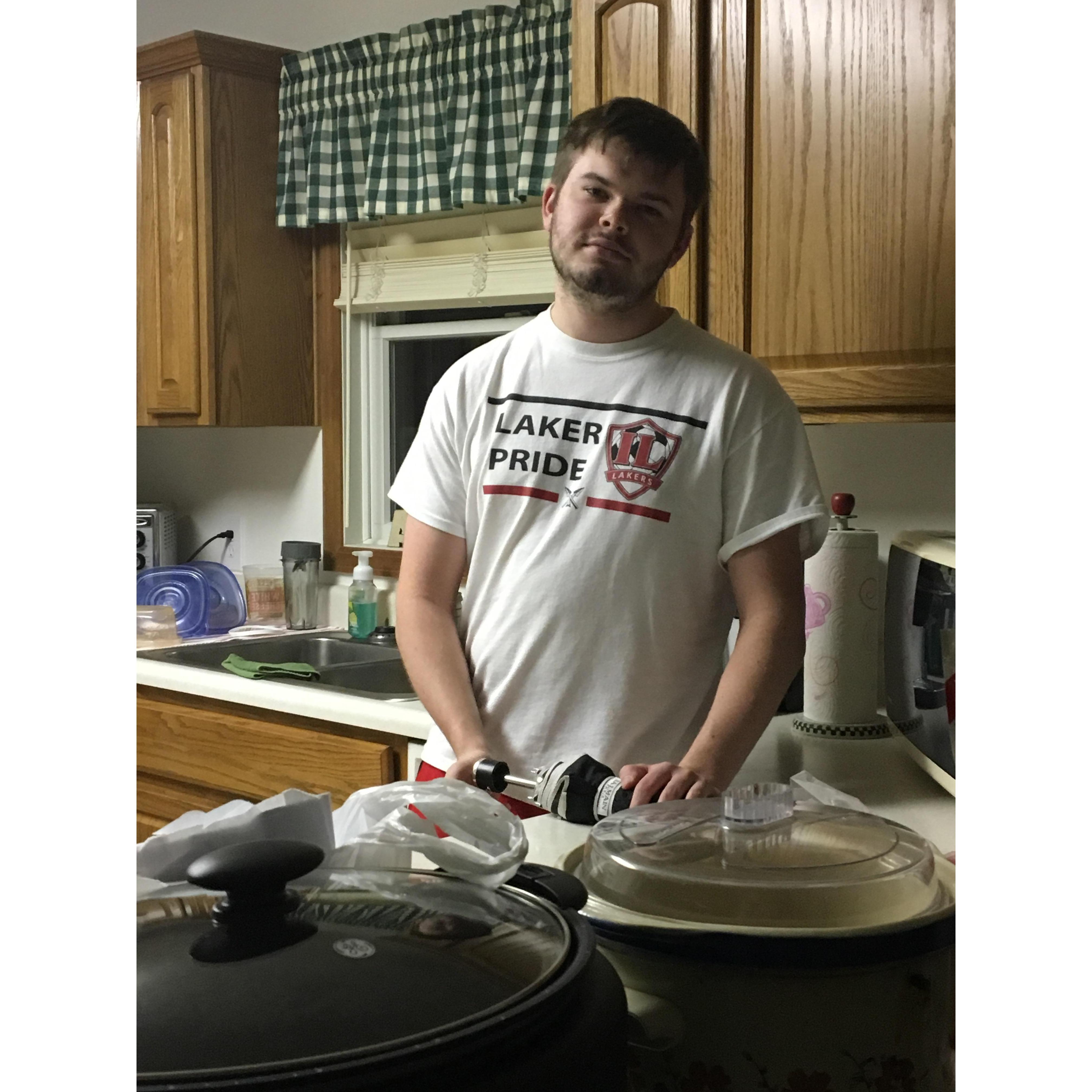 Trying to cultivate his skills in the kitchen for me :)