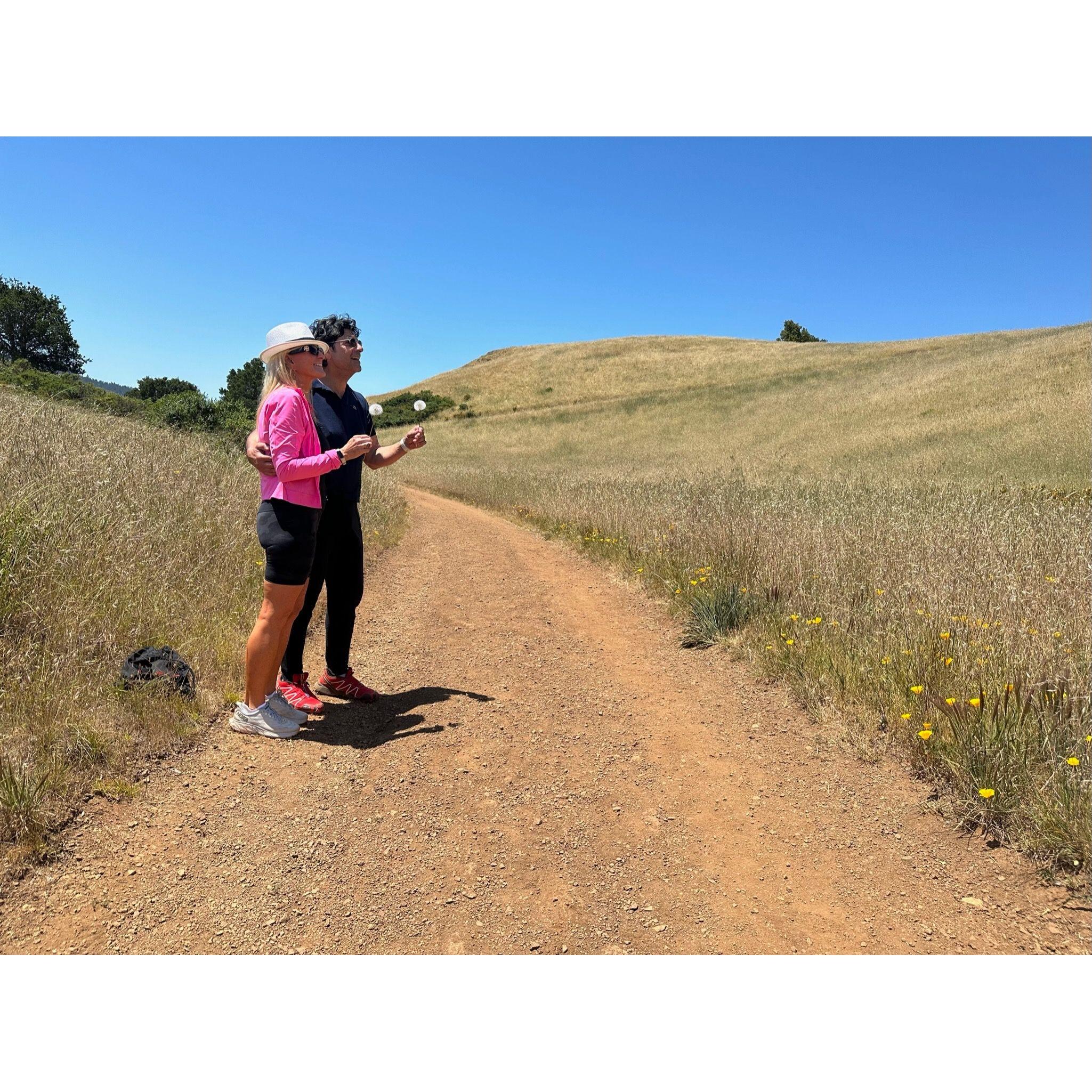 A woman on a bike saw us standing with our dandelions and she stopped to take a picture! One of my favorites.