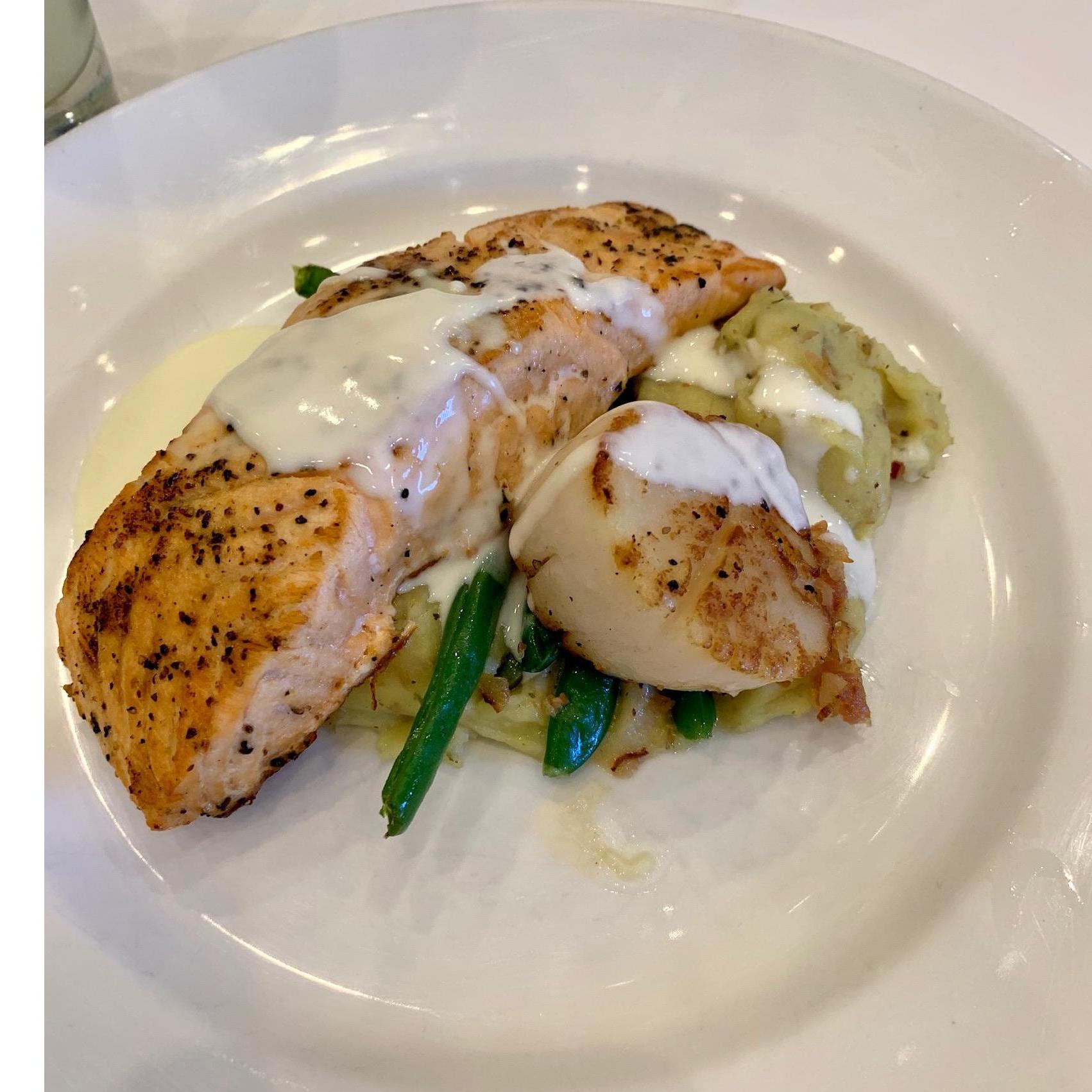 Seared Salmon & Jumbo Scallop, Herbed Mash Potatoes, Bacon Green Beans, Lemon Thyme Butter Sauce.