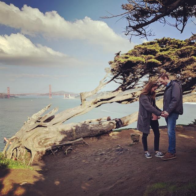 Rory proposing atop a cliff we're trespassing on overlooking the Golden Gate Bridge