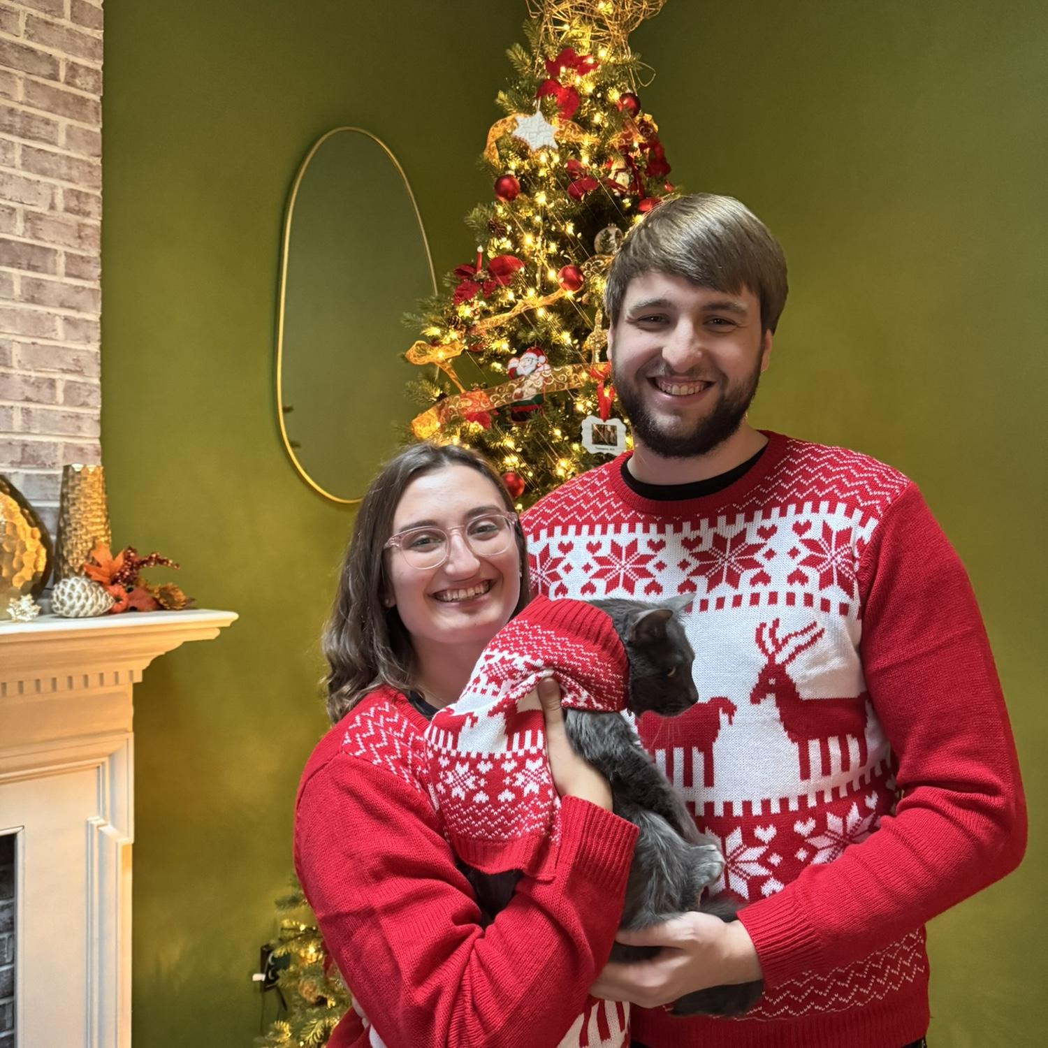 Fun fact: Lauren had a matching Christmas sweater with Dino, her cat, before she had one with Clay. The next year, she bought a matching one for Clay, and he was happy to wear it to Thanksgiving.