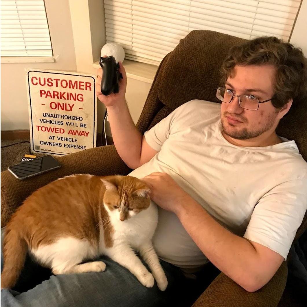 Spencer and Pretzel when she first started getting comfortable enough at her new home to sit on our laps