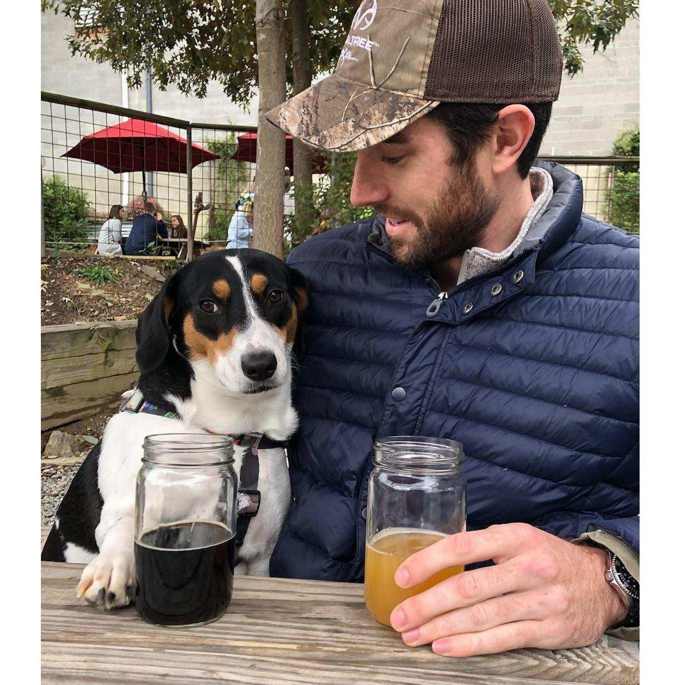 Thomas teaching his oldest daughter (Penny) what good beer taste like!  P.S- This is at Burial Brewery in Asheville, go check it out!