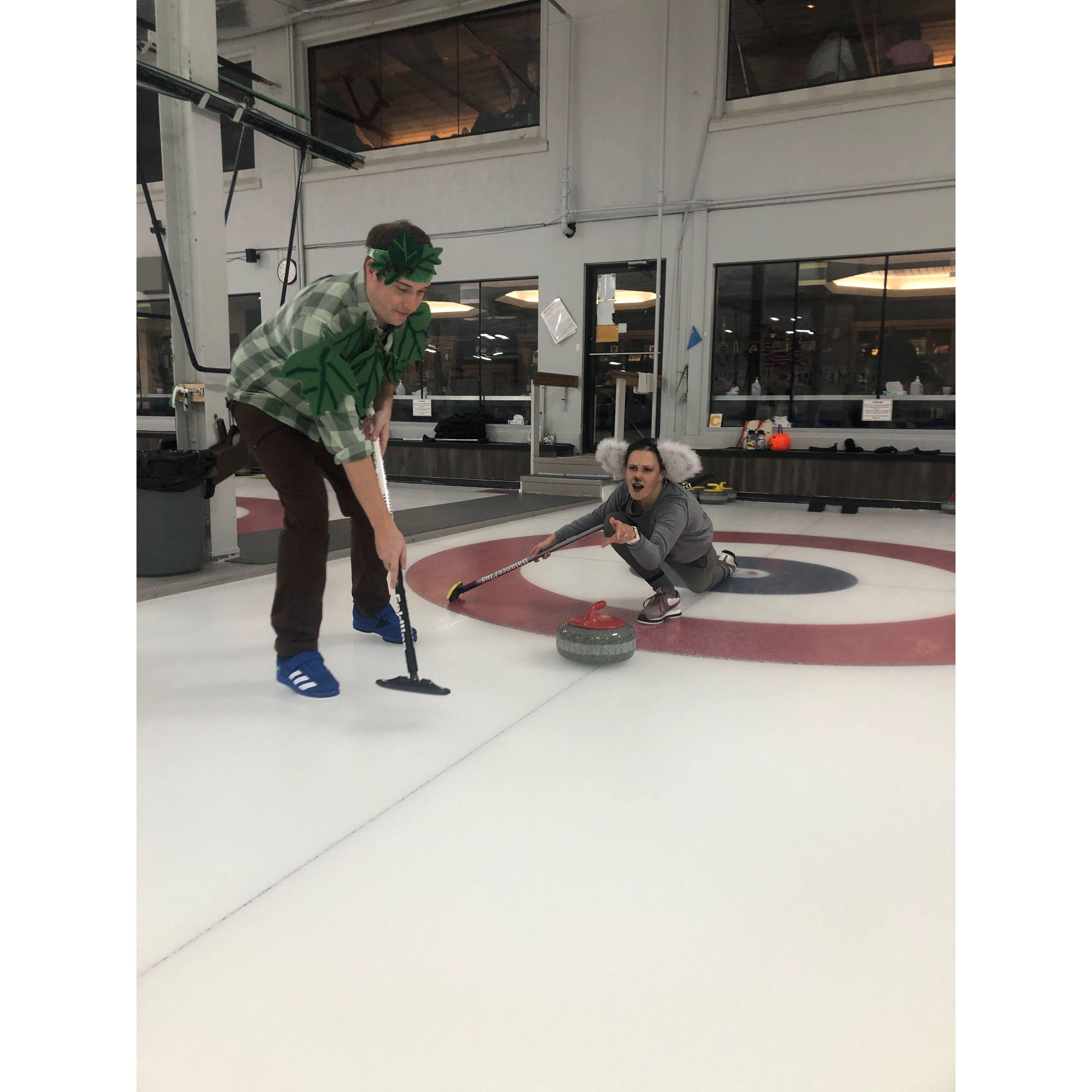 A koala and a tree go curling for Halloween 2023.