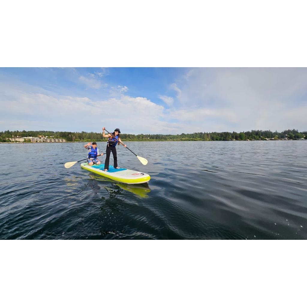 Making waves together—our first time paddle boarding!