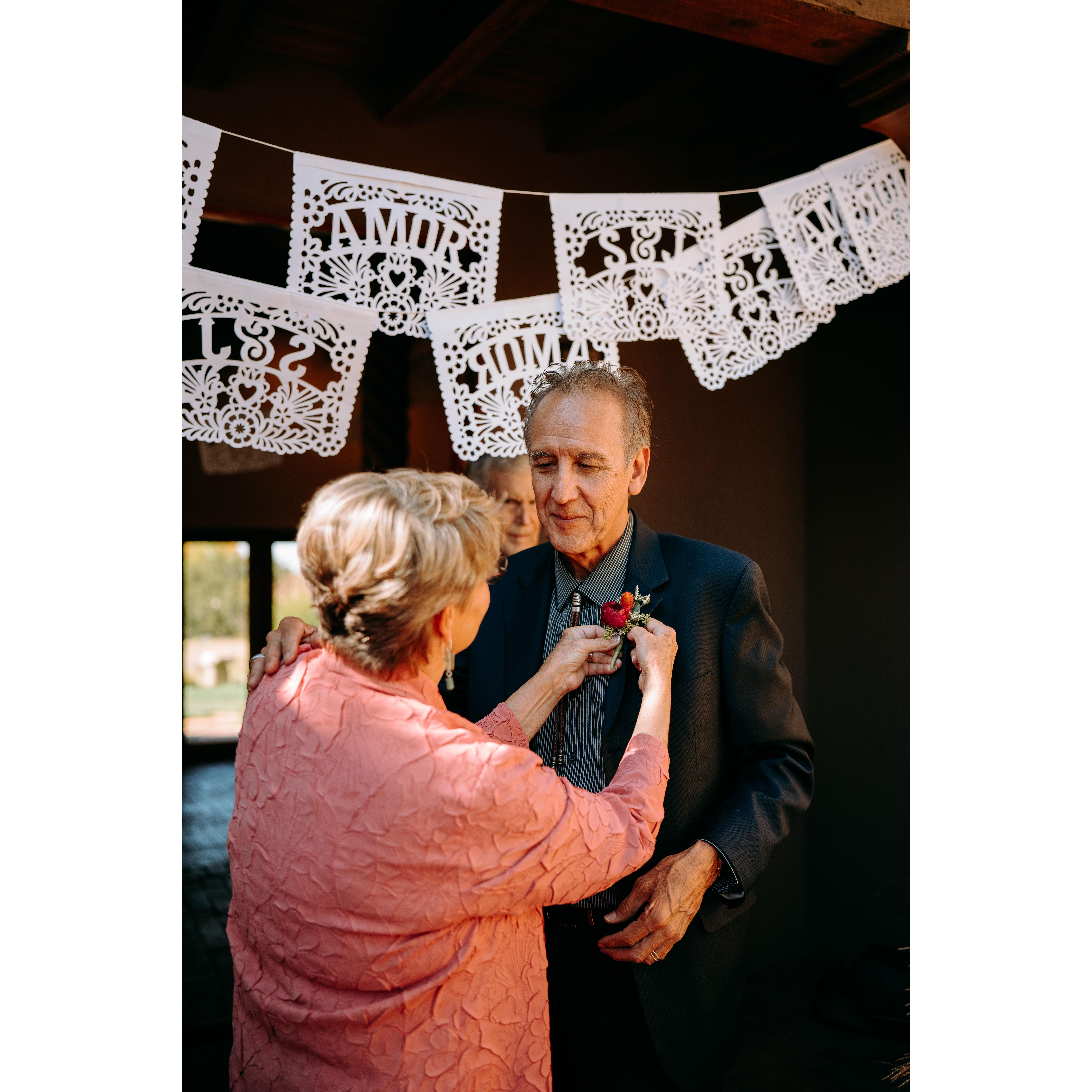 Carol (Shae's Mom) and Ric (Shae's Dad) fixing a boutonniere