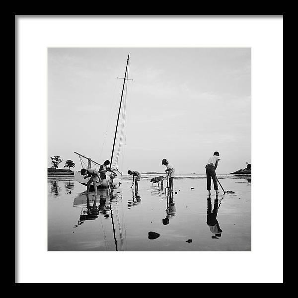 Digging For Clams Framed Print