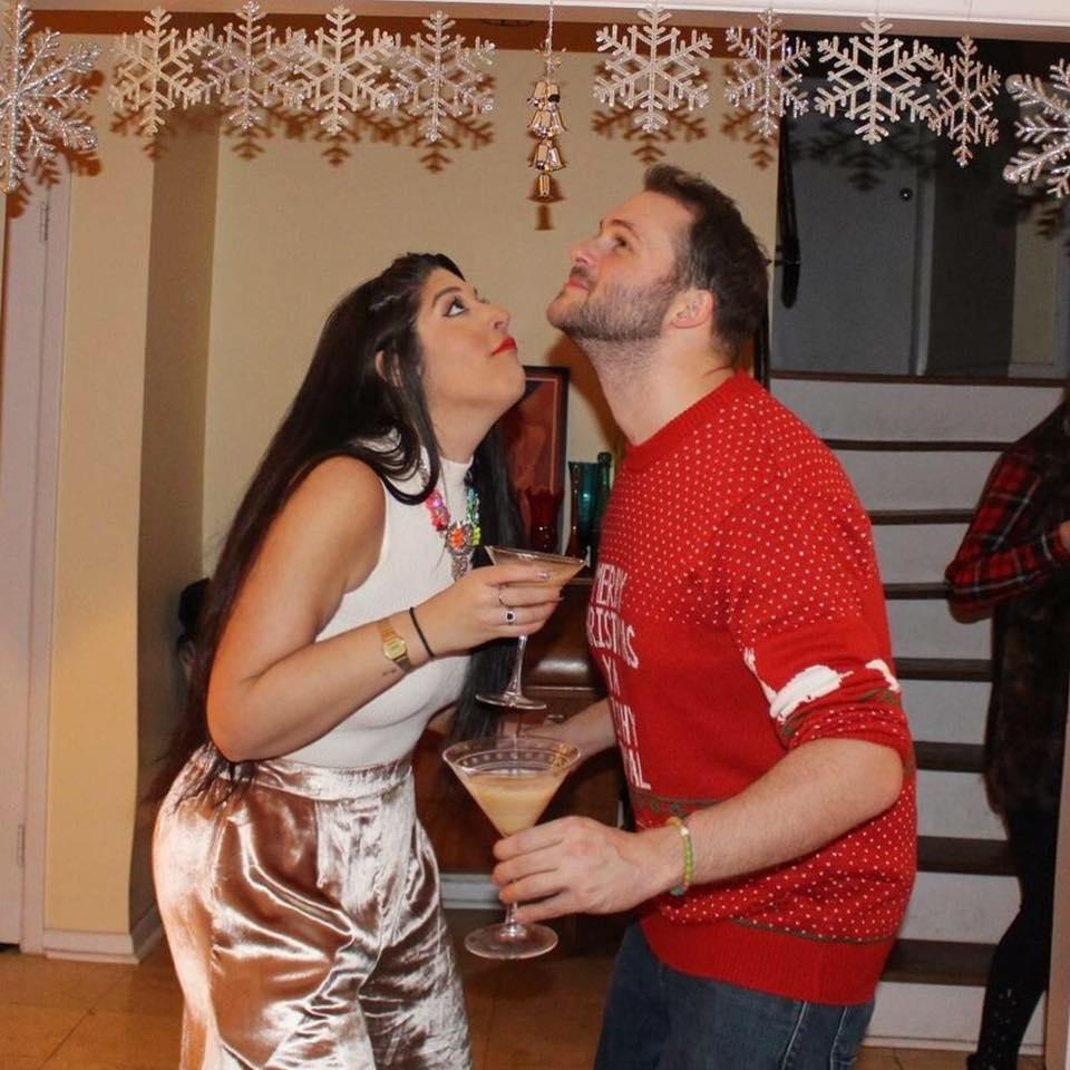 Making weird faces under the mistletoe.