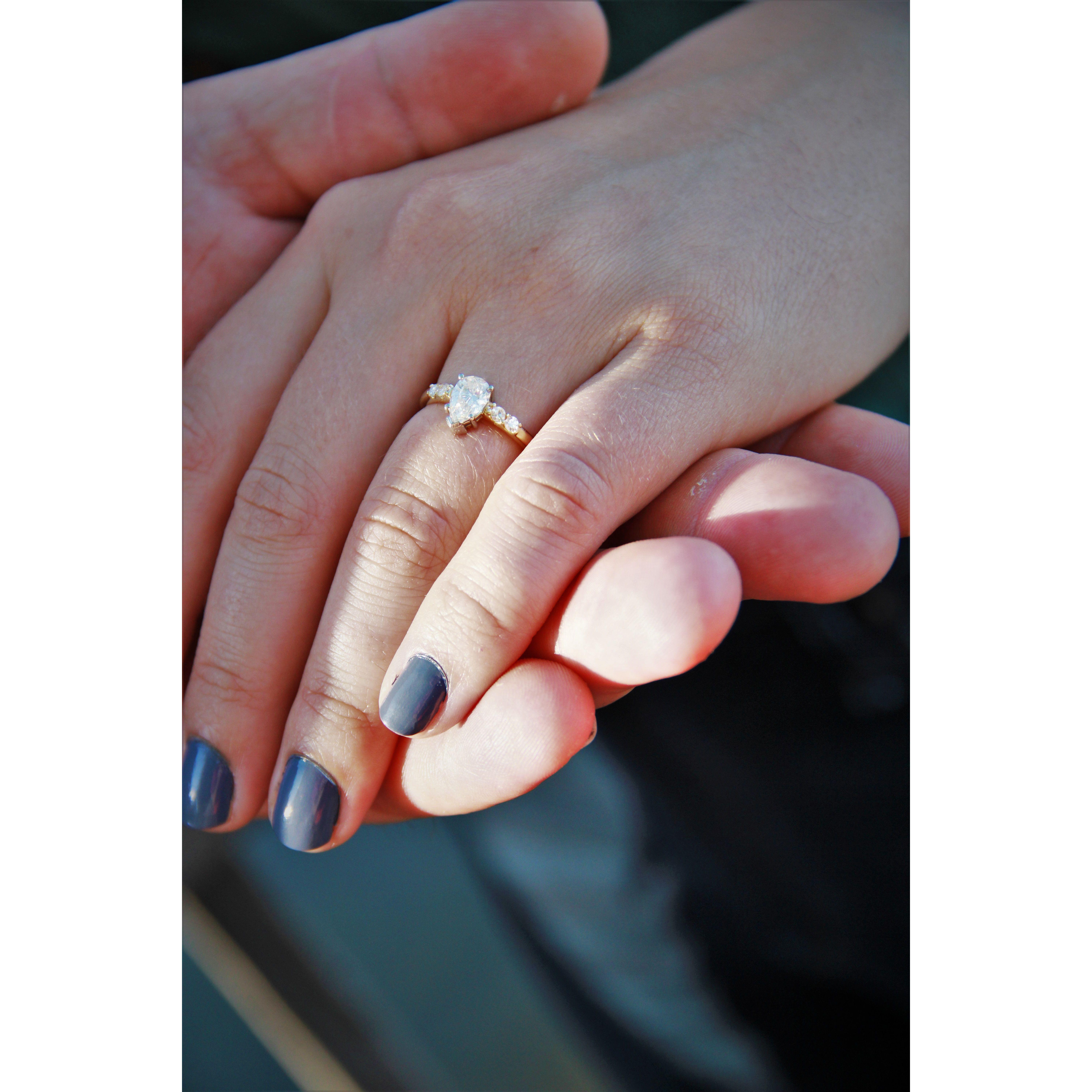 Dan proposed with Mrs. Breslin's engagement ring, which was reset with the family heirloom diamonds into this ring.