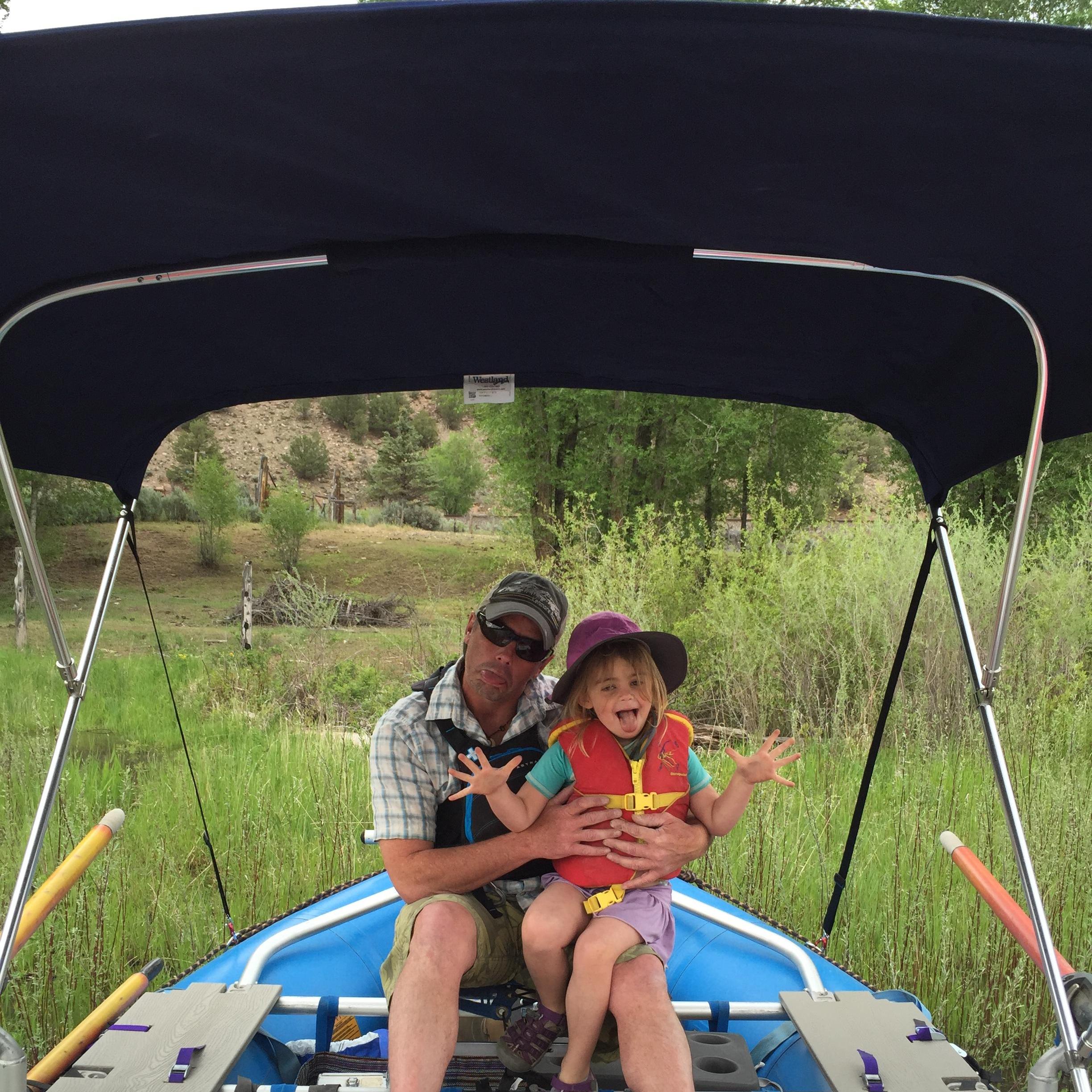 Daddy and B, rafting! B loves to oar the boat.