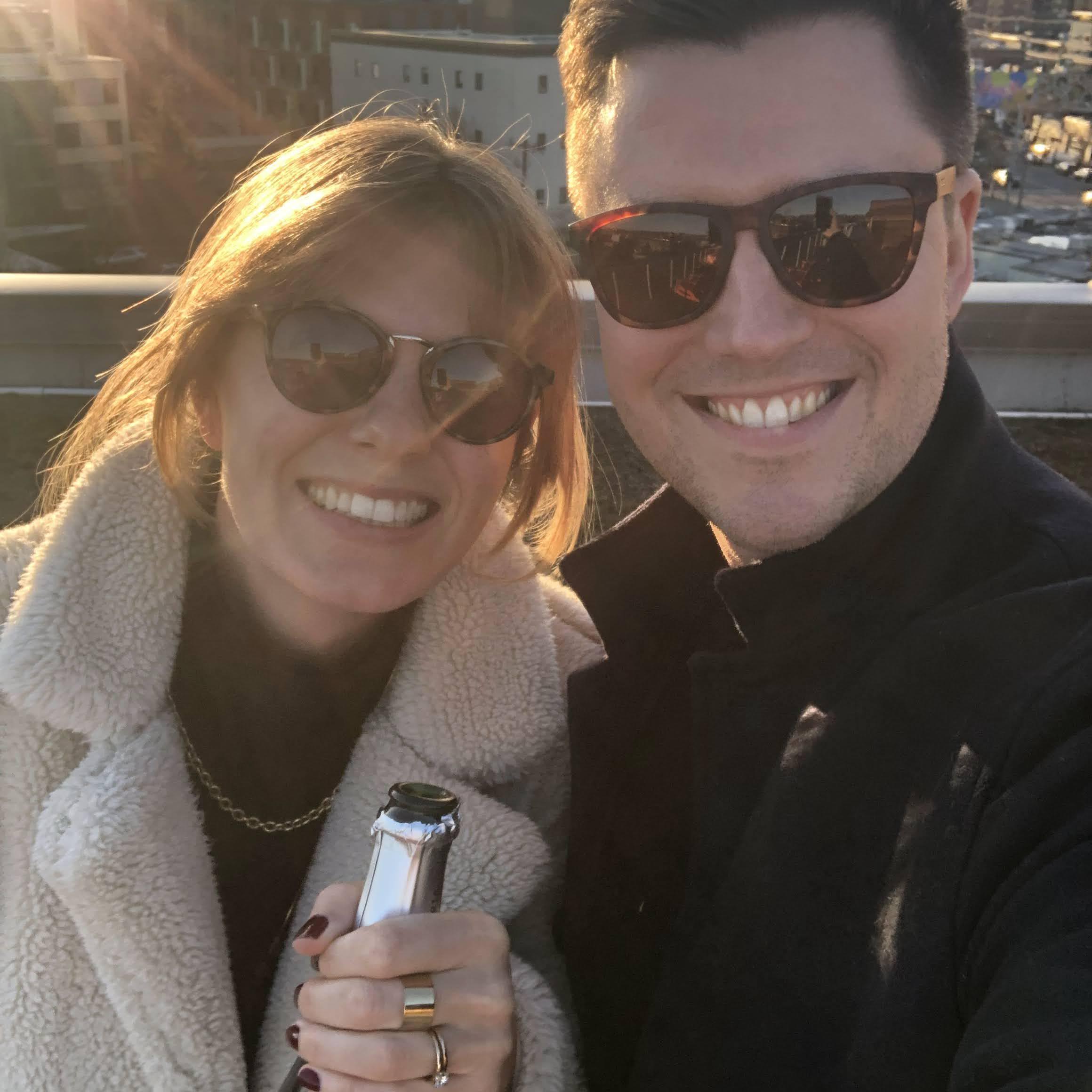 Smiles and prosecco after May told Mark that, yes, she'd marry him on their rooftop in Ballard overlooking Salmon Bay and the Olympics Mountains. February 25, 2022.
