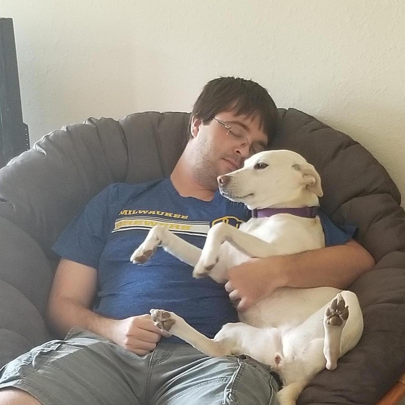 Ryan cuddling our puppy after we first brought her home