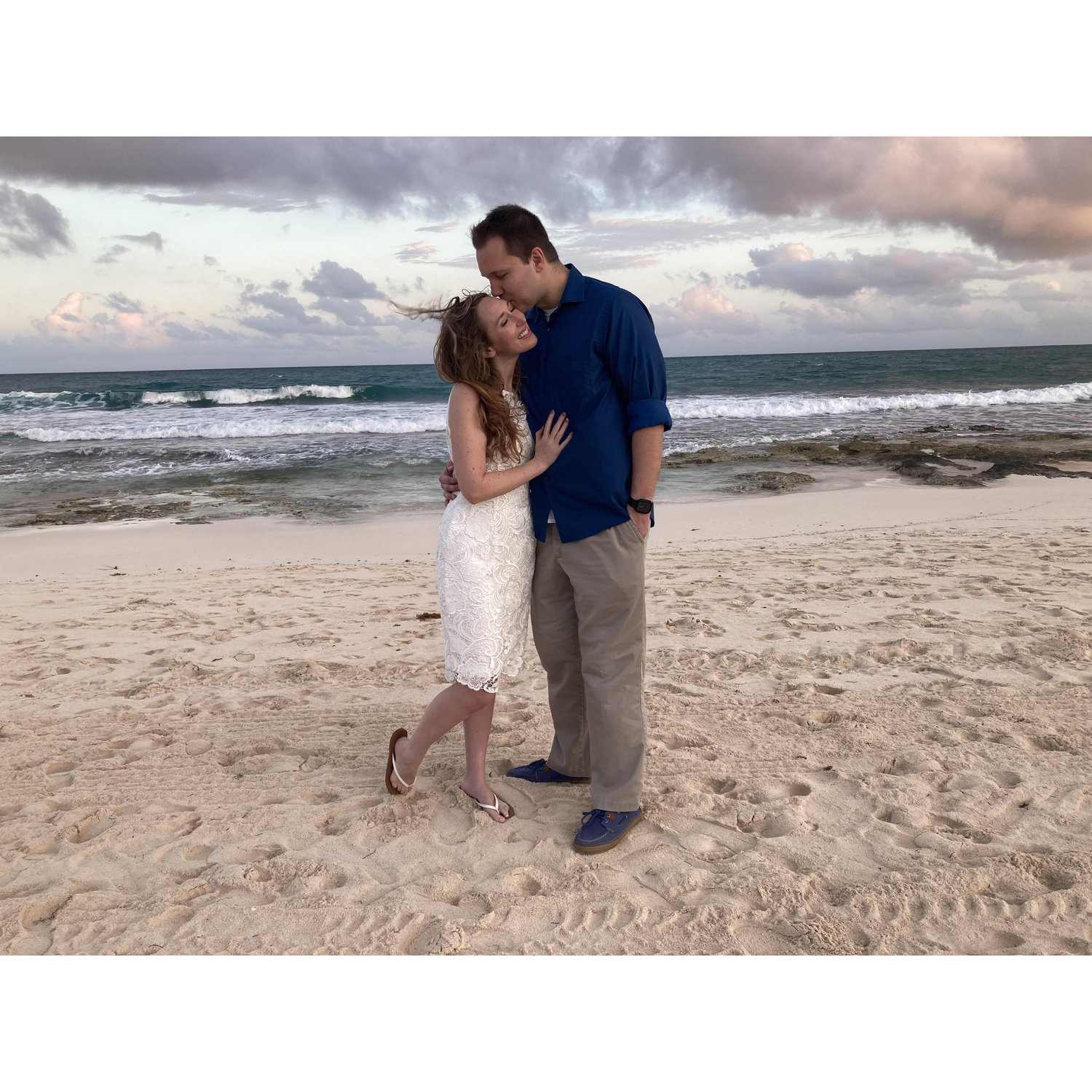 Posing in front of the ocean before our romantic dinner on the beach during our honeymoon in Riviera Maya last February.