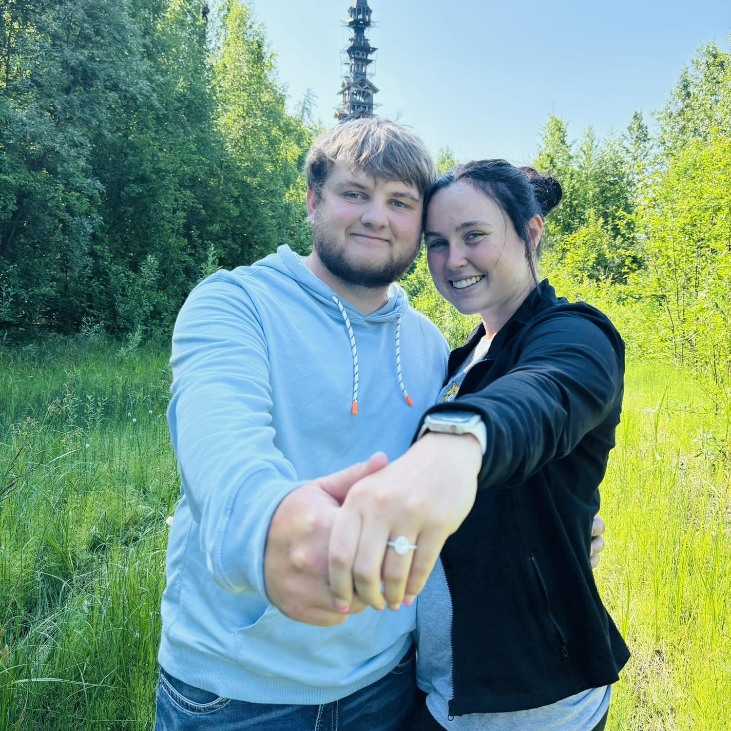 Got engaged on the trip of a lifetime in Alaska. Dakota proposed at the top of the tower in the background of this picture.