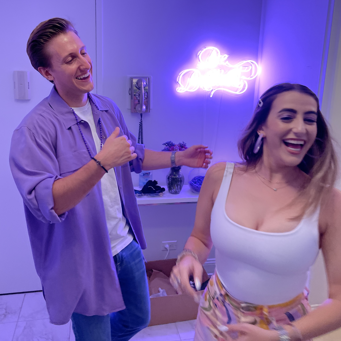 Sam laughing at the fact that Sydney will be forcing him to wear purple for the rest of his life