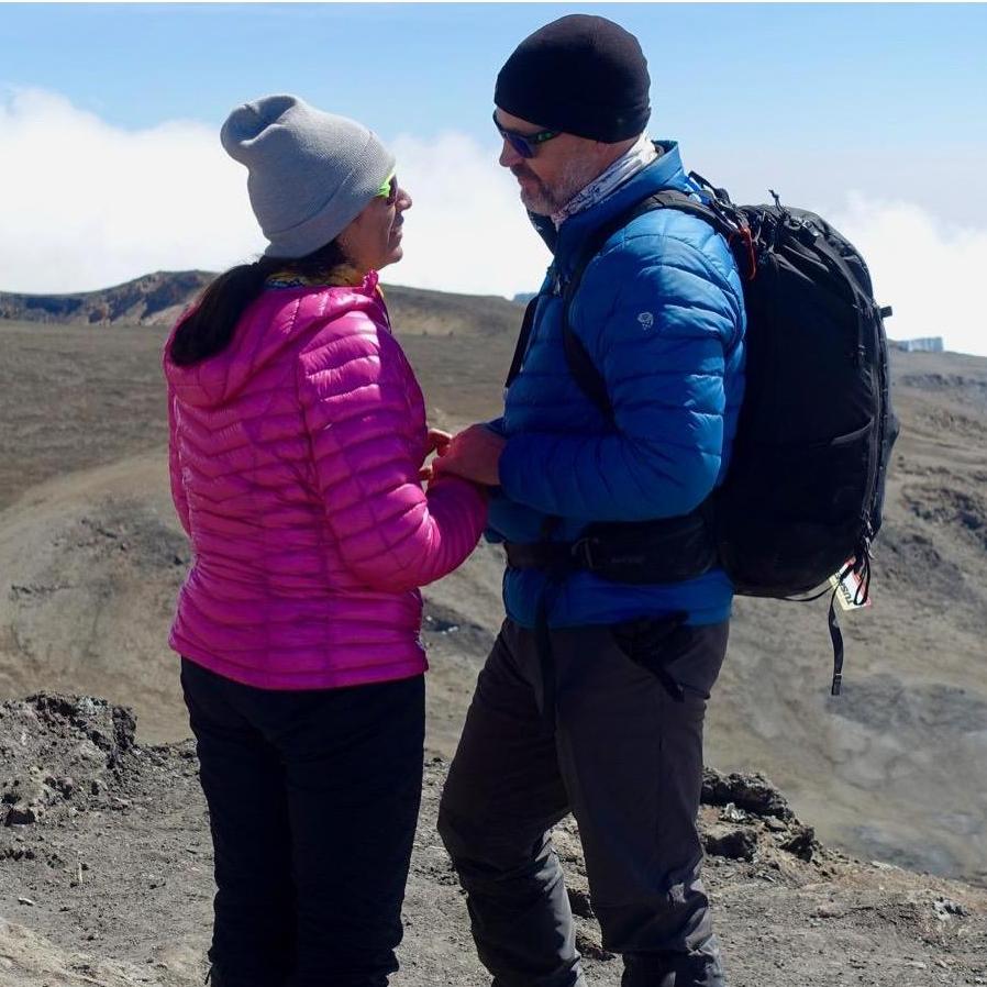 Surprised Lorraine with the big question at the summit of Kilimanjaro.  Thankfully, she was low on oxygen and said yes!