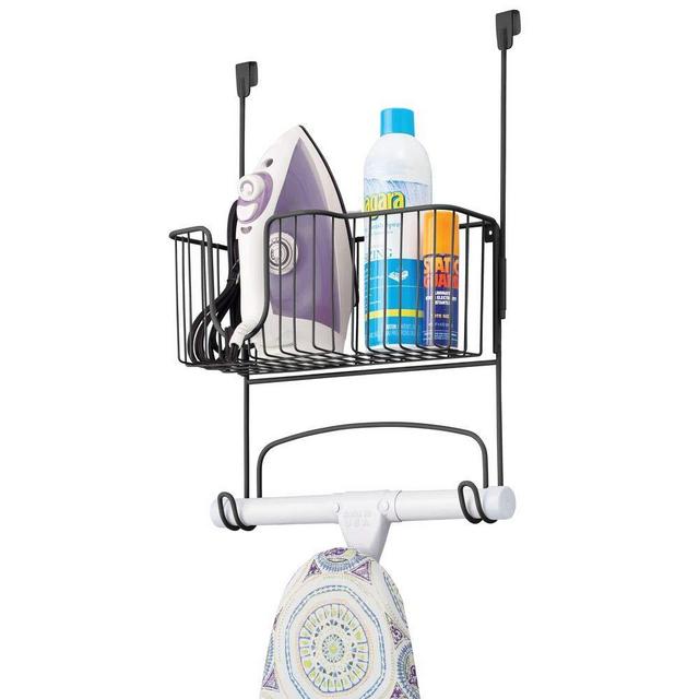 mDesign Metal Over Door Ironing Board Holder with Large Storage Basket - Holds Iron, Board, Spray Bottles, Starch, Fabric Refresher - for Laundry, Utility Room, Garage - Matte Black