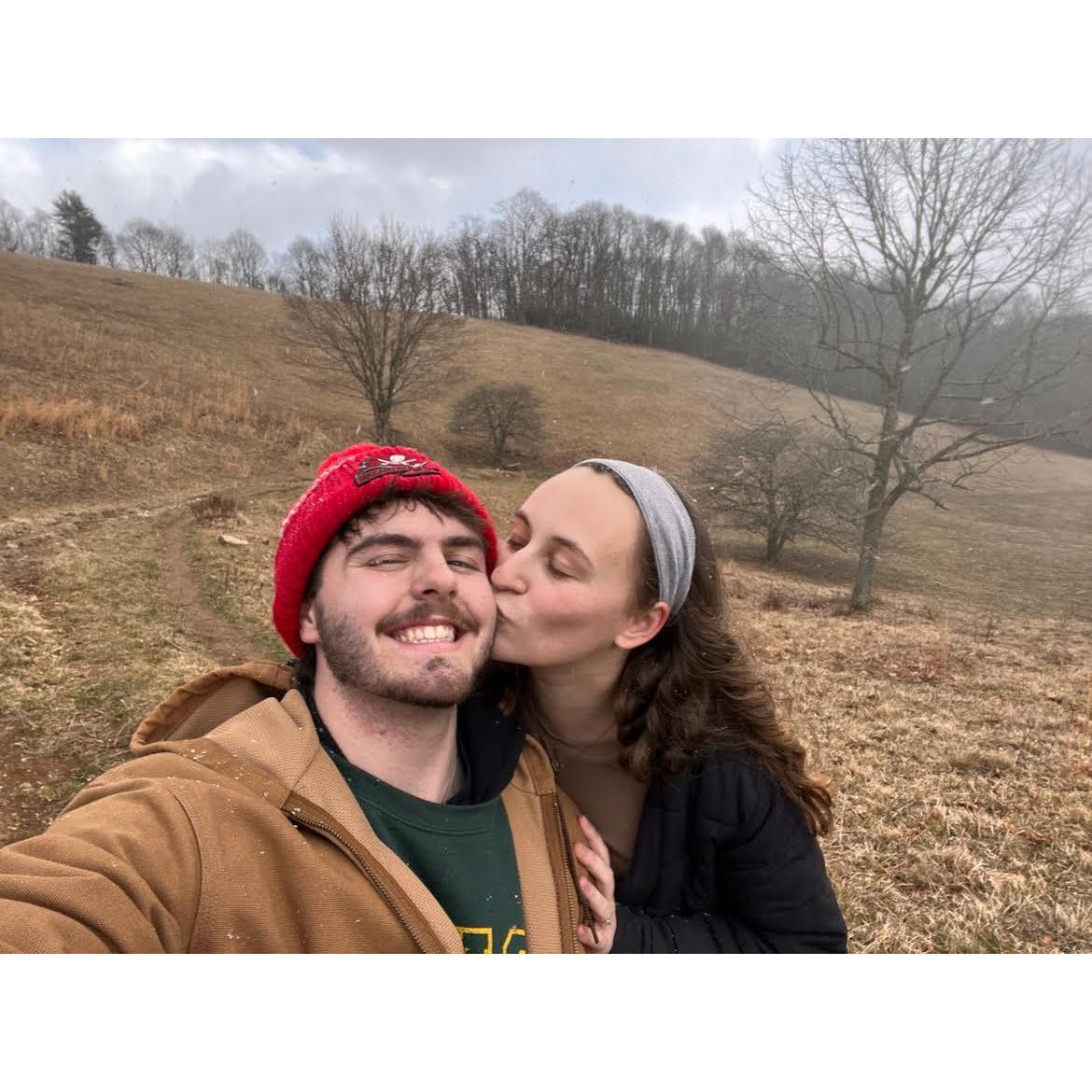 Kisses on a hike post-snow tubing.