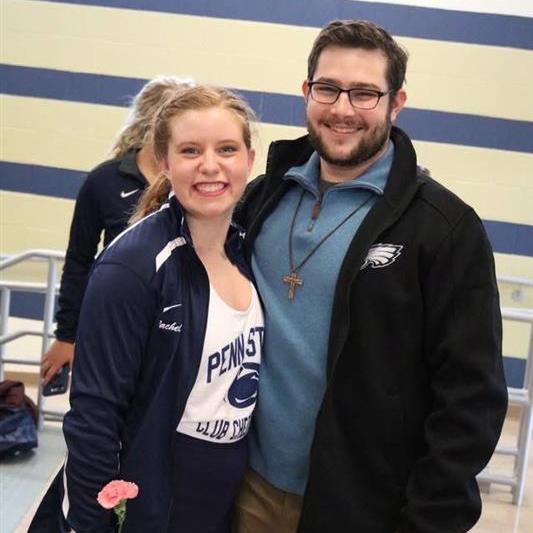 Zach supporting Rachel at her cheer competition!