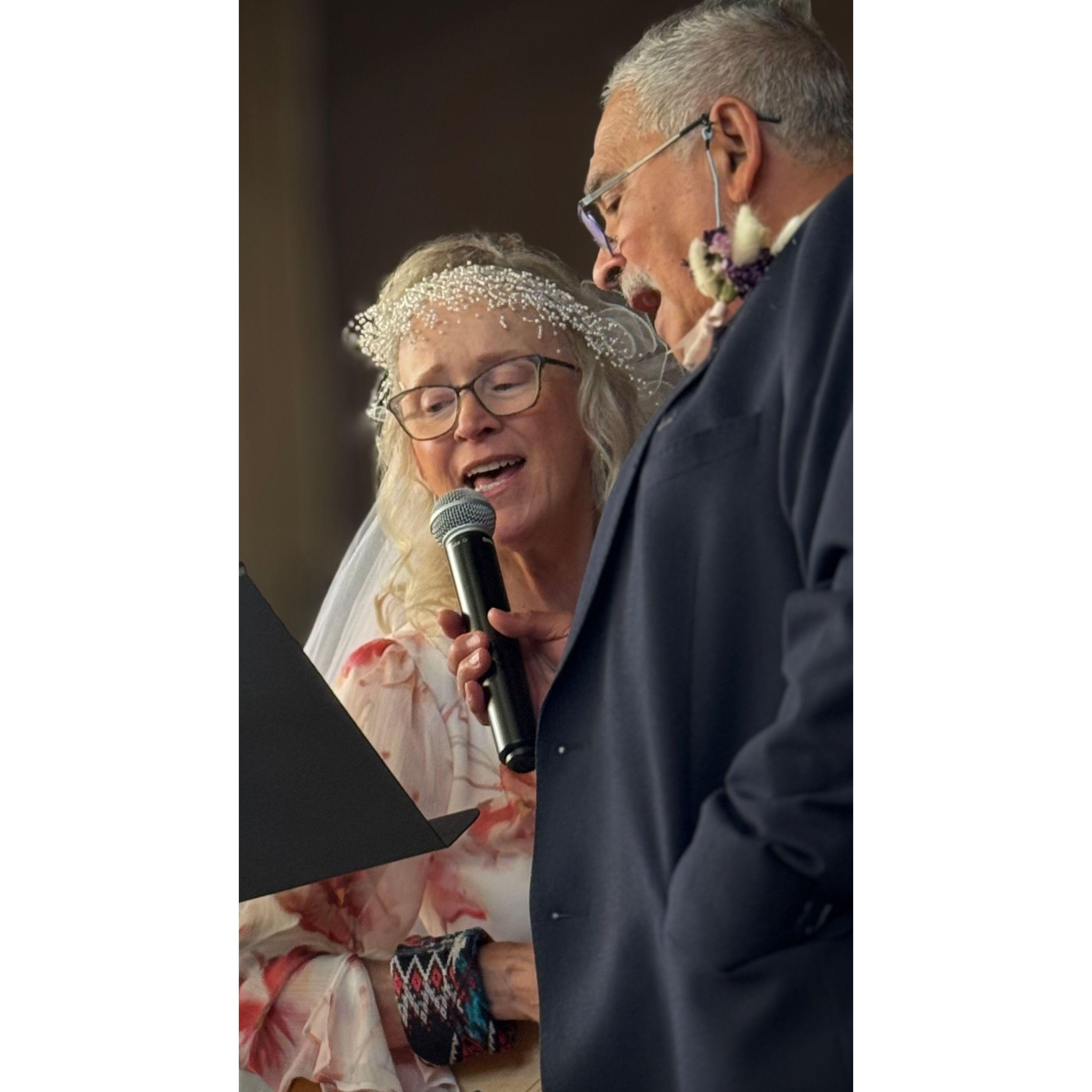 Leonard and Anita sing together.