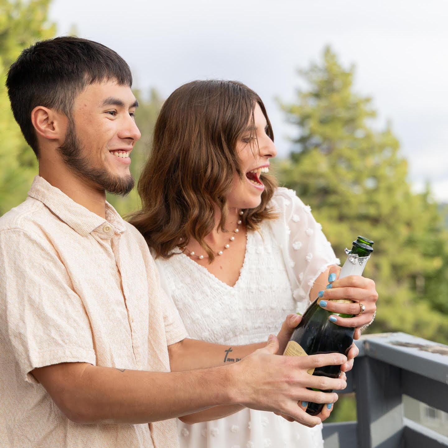 Max learning how to open champagne so they can properly celebrate