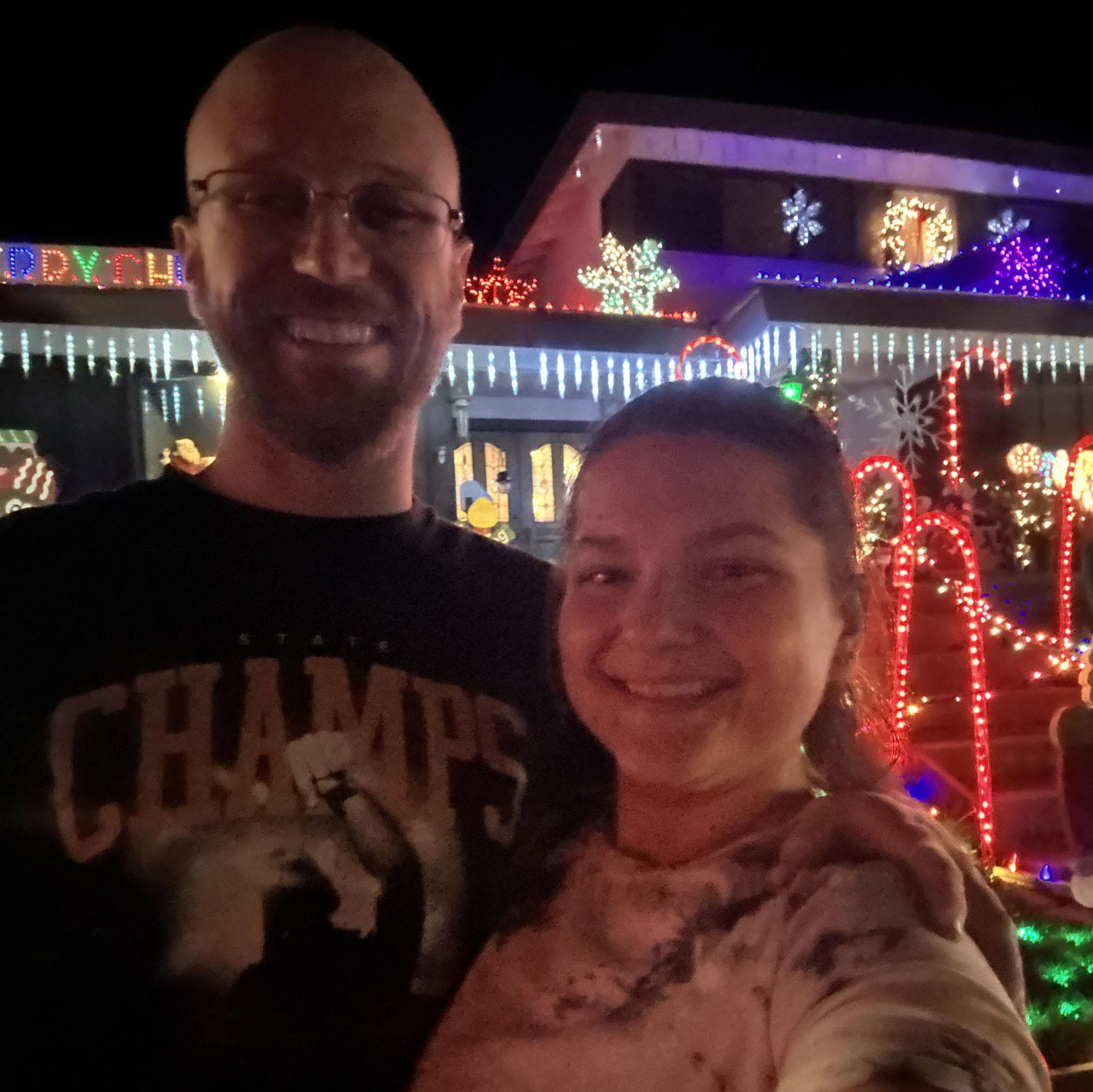 Katie lovingly forcing Jeff to enjoy Christmas lights with her
