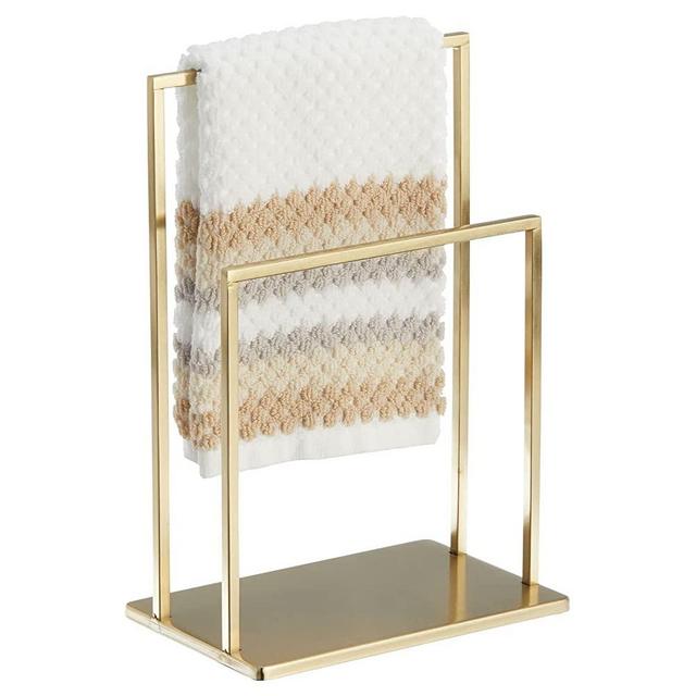 mDesign Modern Decorative Metal Fingertip Towel Holder Stand for Bathroom Vanity Countertops to Display and Store Small Guest Towels or Washcloths - 2-Sided - Soft Brass
