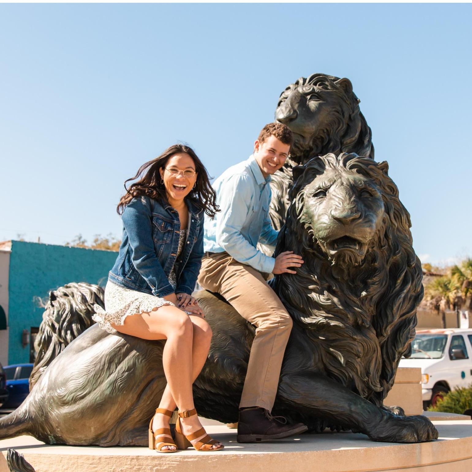 Of course Landon made us take a picture on these lions