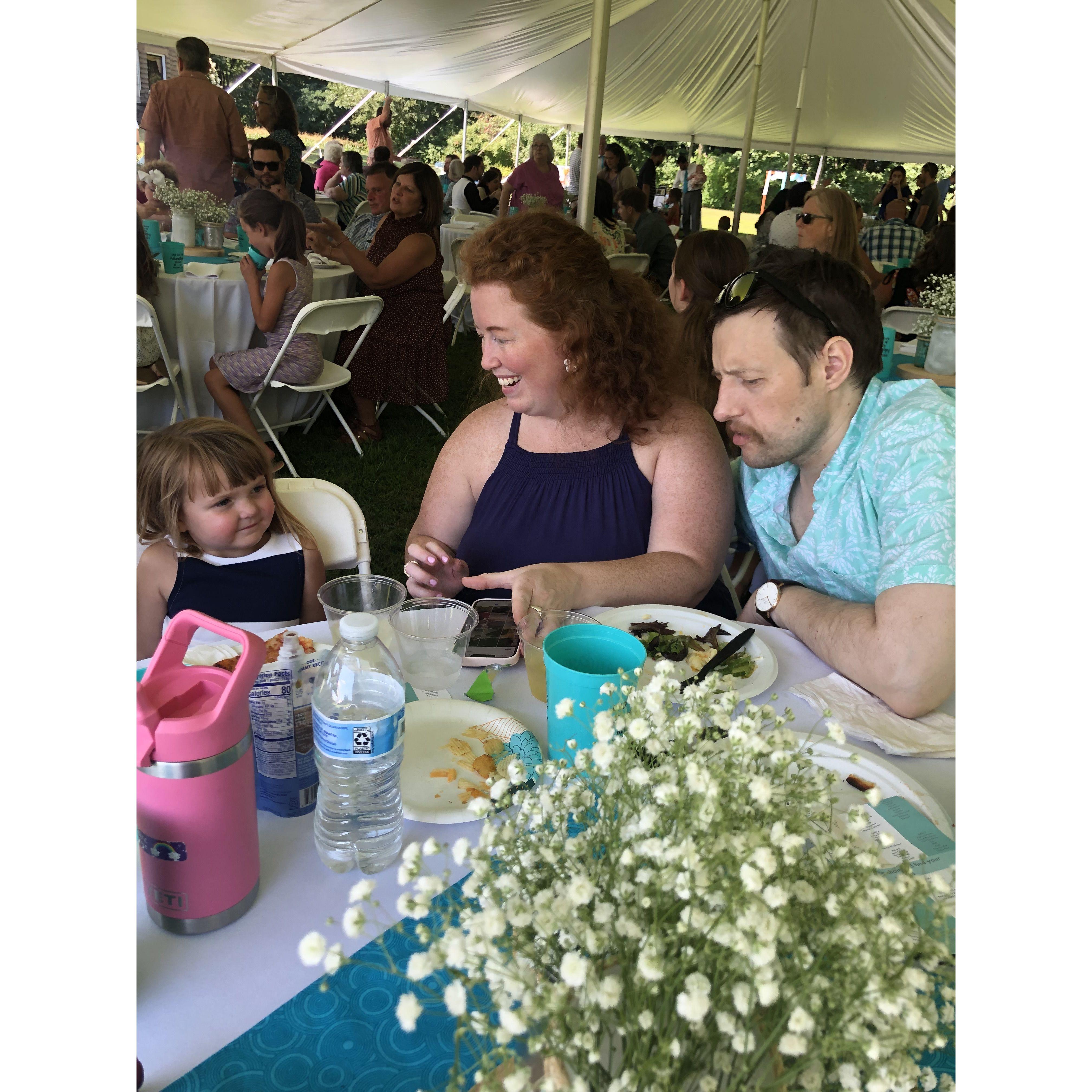 At cousin Becca's wedding getting custom art from Uncle Jon.
