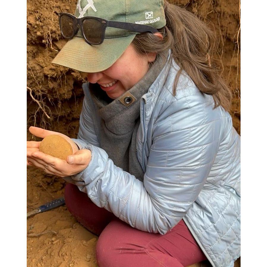 Sylvana right after unearthing a fresh geode at Red Top Lookout! She's so proud of her little rock baby