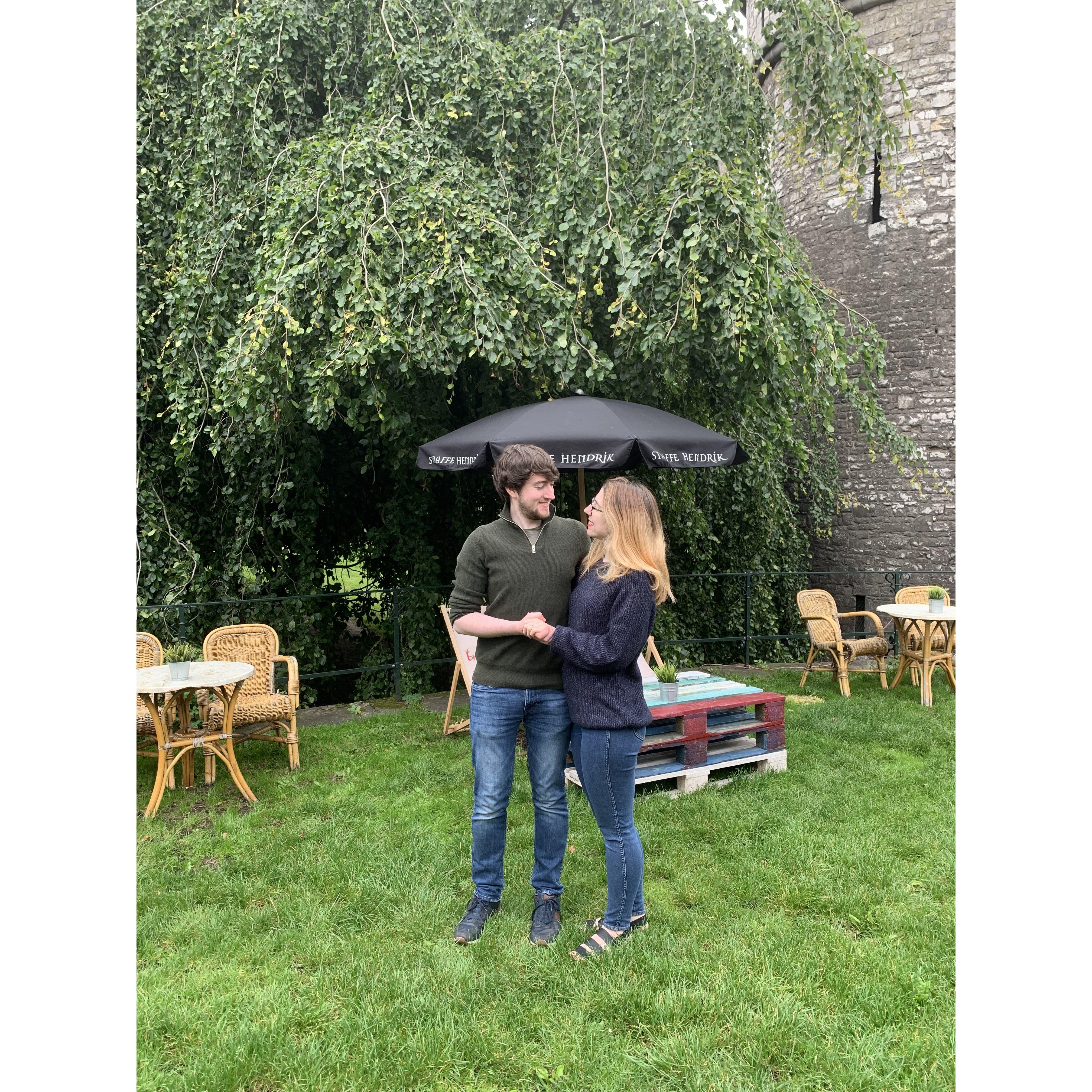 We got engaged under the willow tree behind a stone castle!
