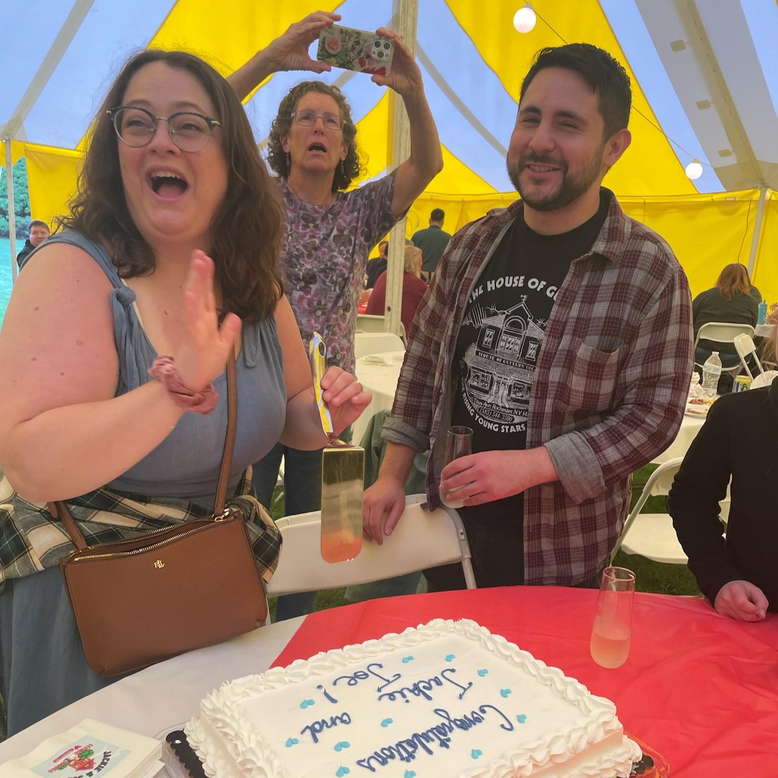 Professional photography from Aunt Ellen under the big yellow tent for the cake cutting