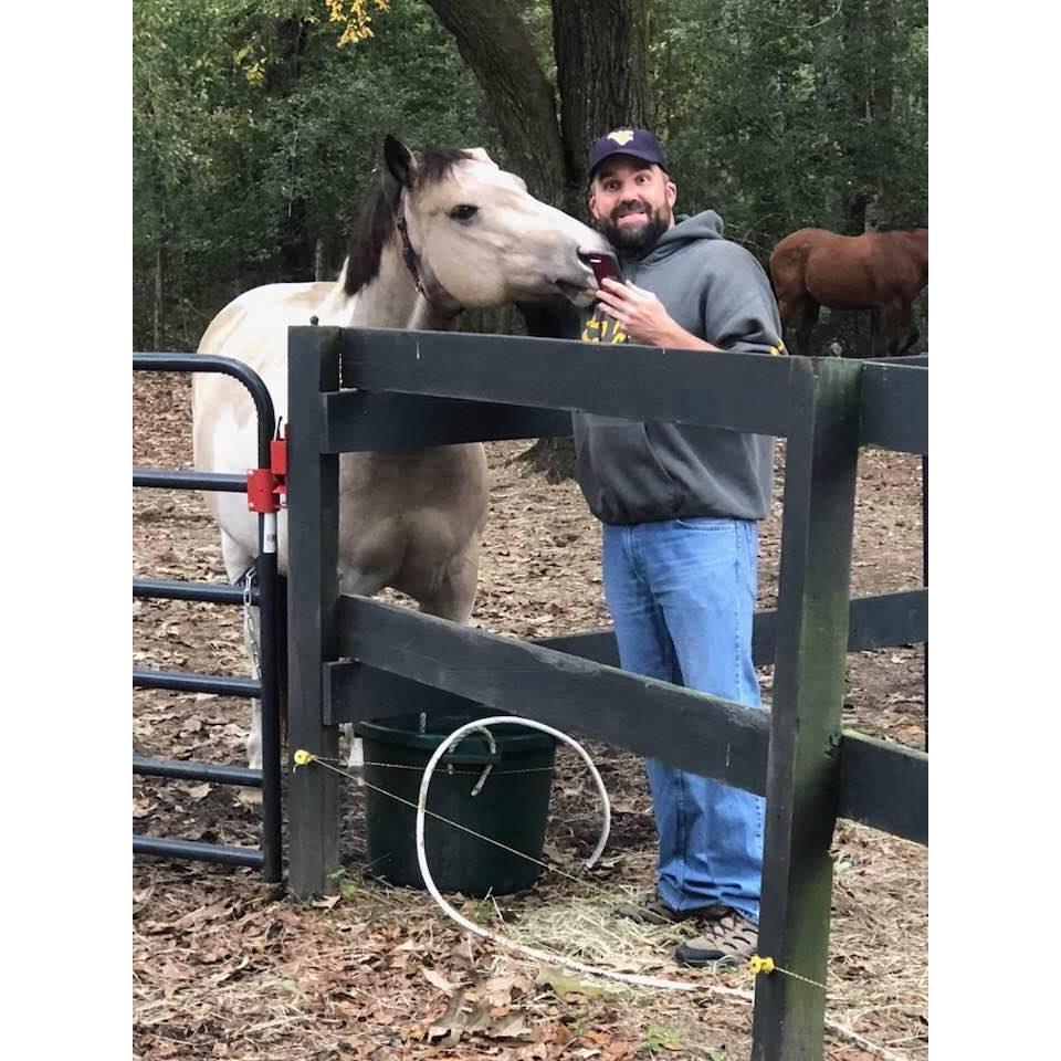 He thinks the horse is gonna eat him....