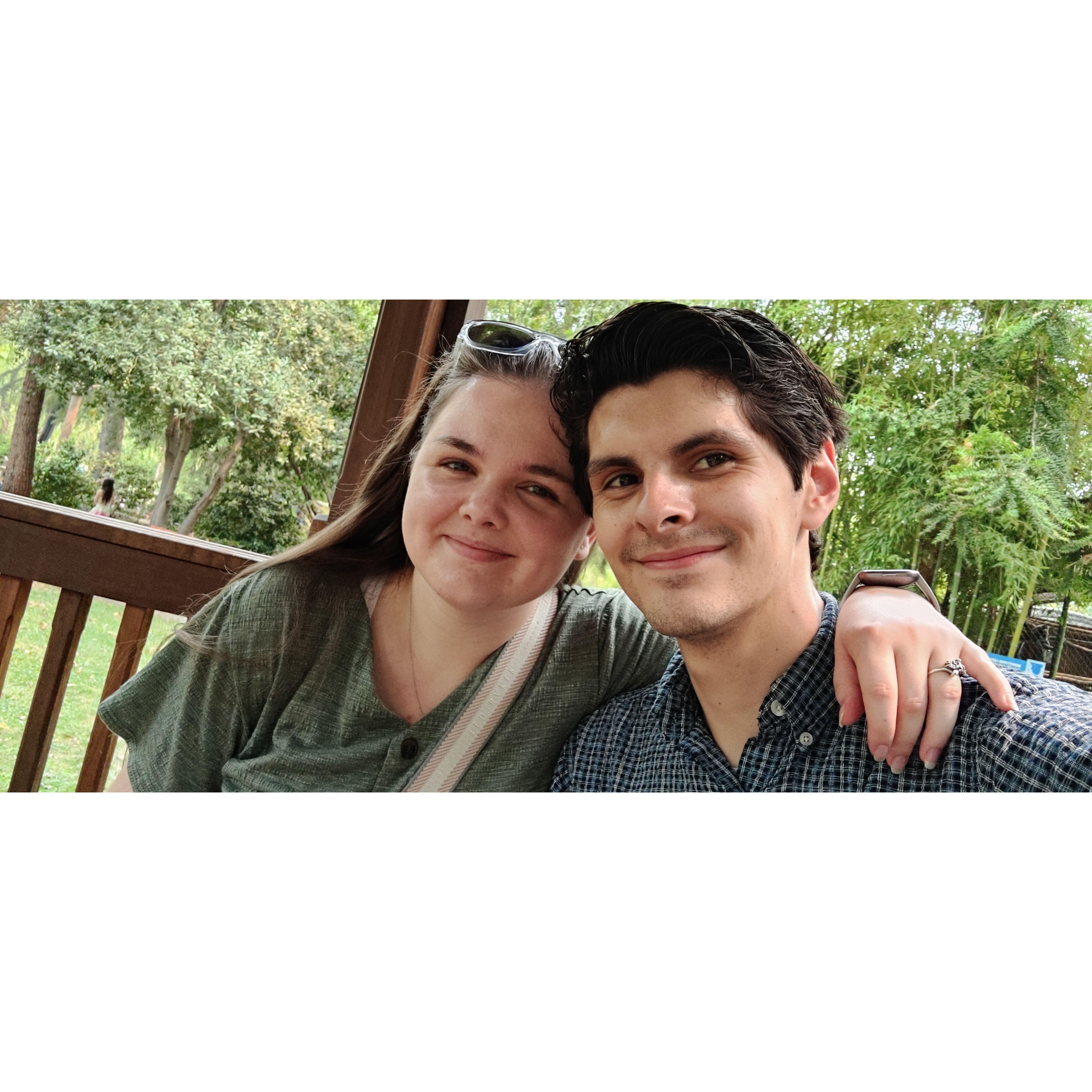 The couple's first trip together to Davis and Sacramento, California in 2021. This picture was taken after they fed a giraffe at the Sacramento Zoo.
