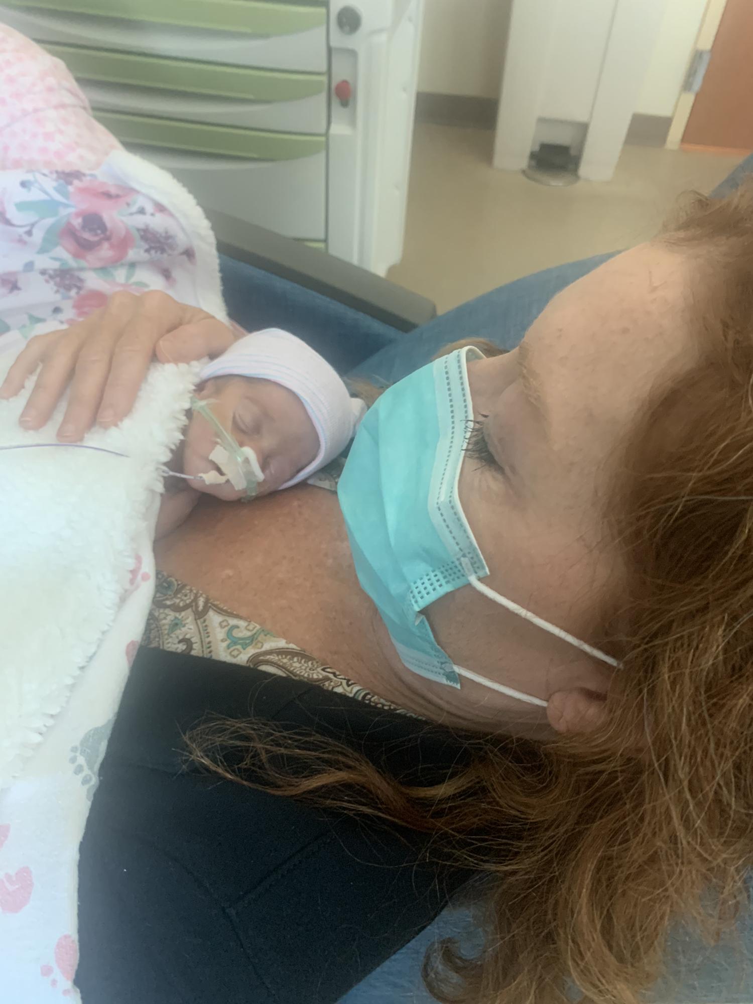 Grandma DeDe holding Kinley for the first time