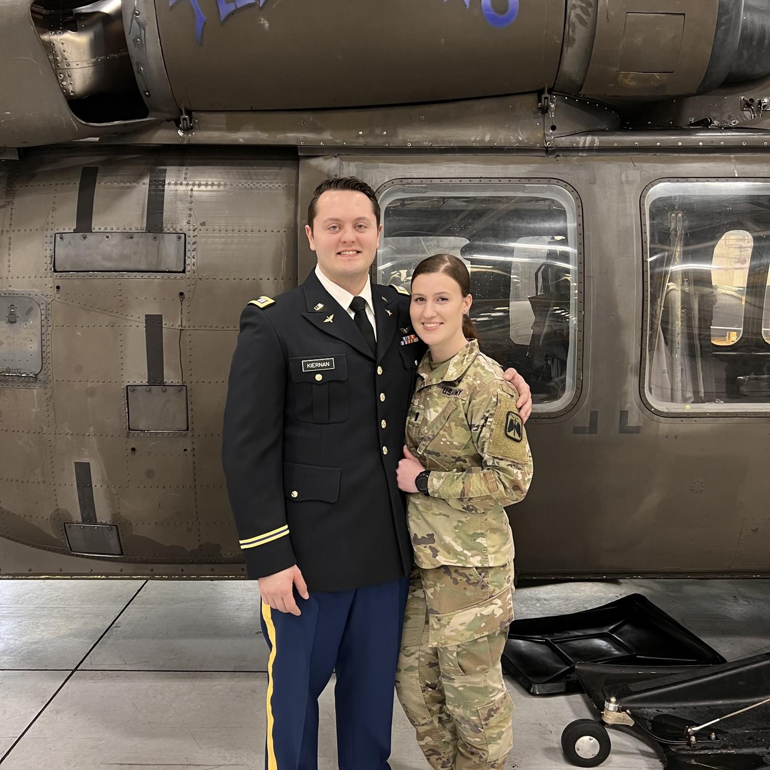 William promoting to Captain - Marissa pinned his new rank.
