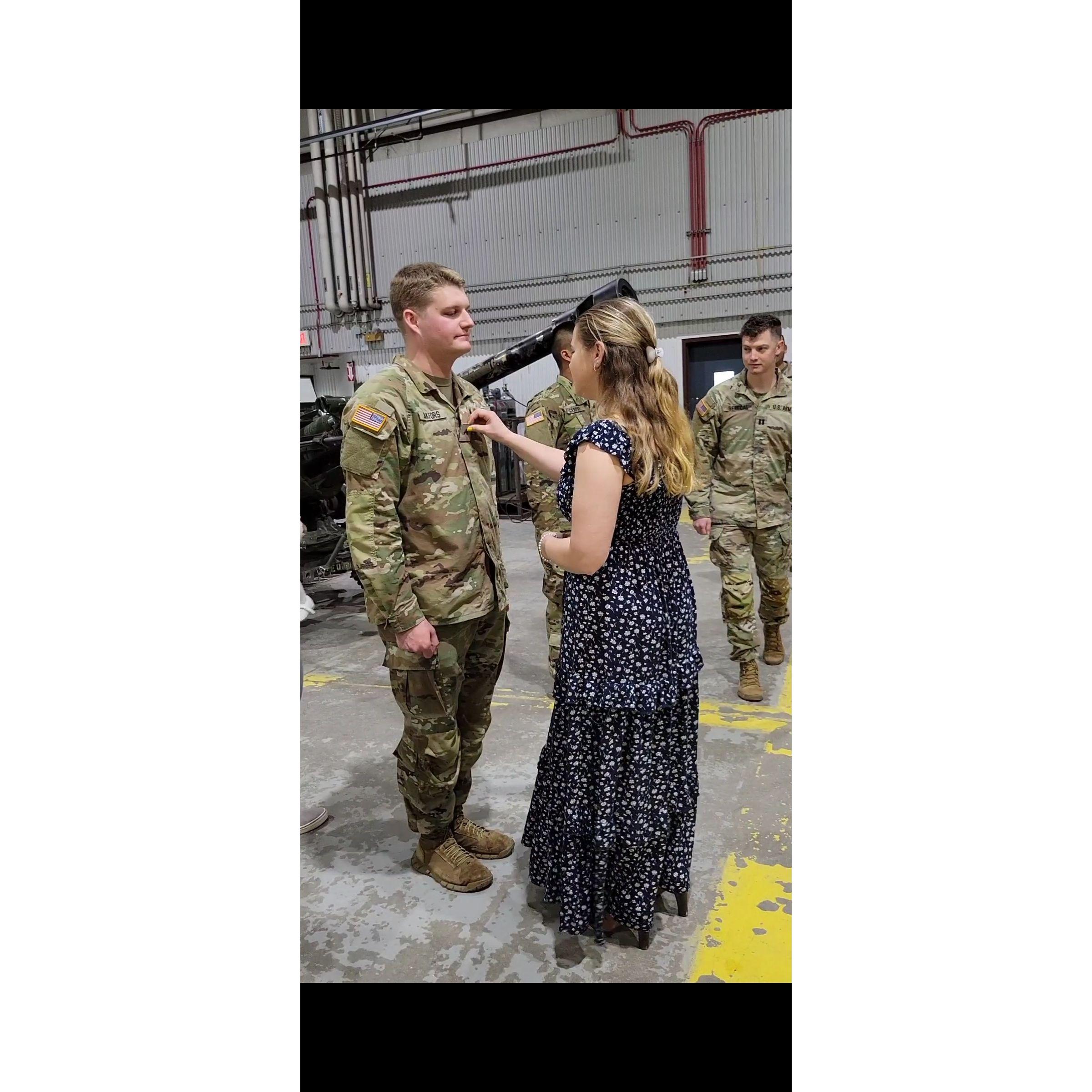 Erin pinning Nick at a Promotion Ceremony in May 2022