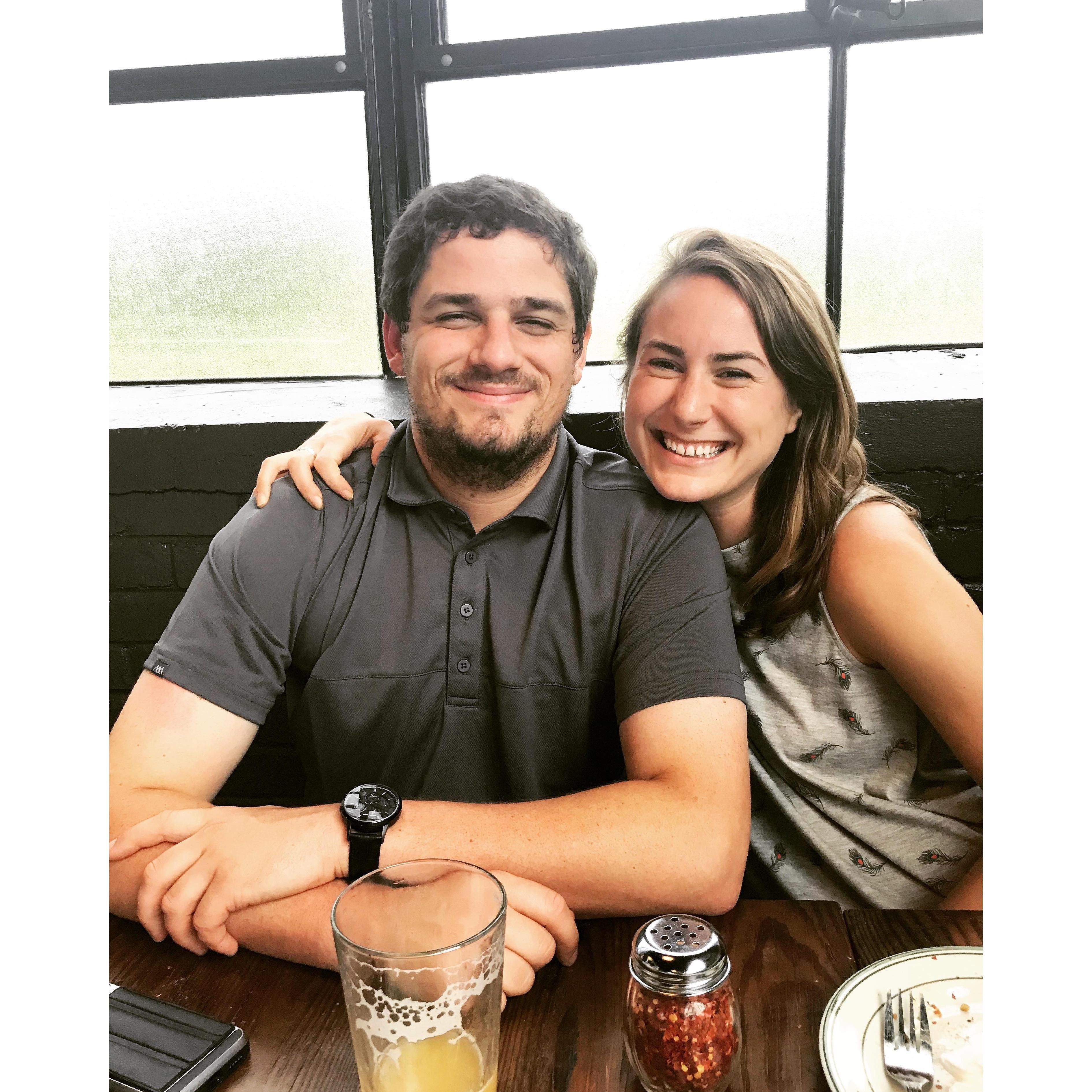 Surrounded by our favorite things: pizza and beer!