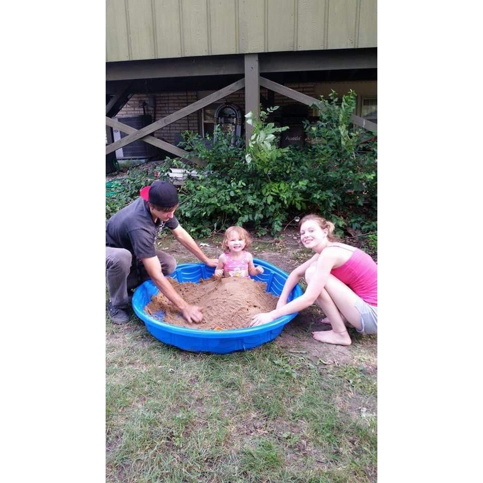 Burying Ava in the sand