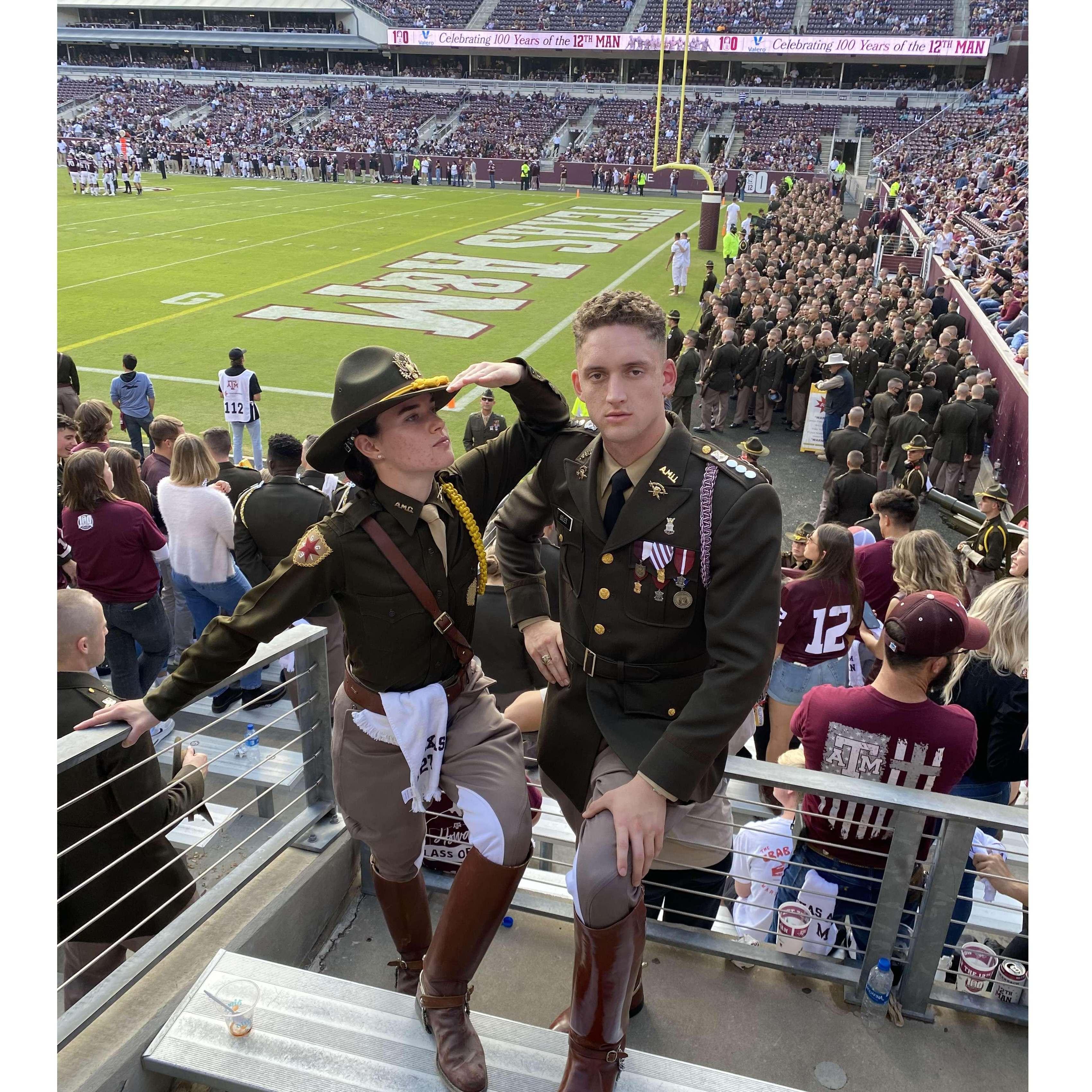 There are only so many opportunities to look good in uniform at an Aggie football game! :D Behind us, you can see the Corps fish (freshmen) as they prepare to rush the field after a win from our boys!